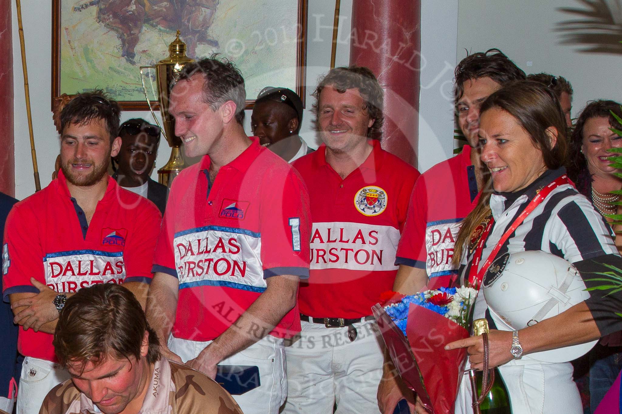 DBPC Polo in the Park 2012: At the price giving for the Help for Heroes Exhibition Game: The Dallas Burton Polo Club home team, Will Wood, Major Rob Skeggs, Mark Weller, and Captain Wiliam Mawby. On the right Swiss umpire Barbara Zingg..
Dallas Burston Polo Club,
Stoneythorpe Estate,
Southam,
Warwickshire,
United Kingdom,
on 16 September 2012 at 19:21, image #362