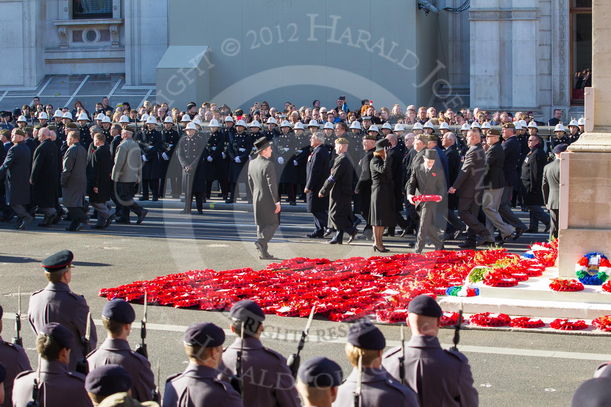 Remembrance Sunday 2012 Cenotaph March Past: Wreaths are placed at the western side of the Cenotaph during the March Past, creating a field of red poppies..
Whitehall, Cenotaph,
London SW1,

United Kingdom,
on 11 November 2012 at 11:53, image #764