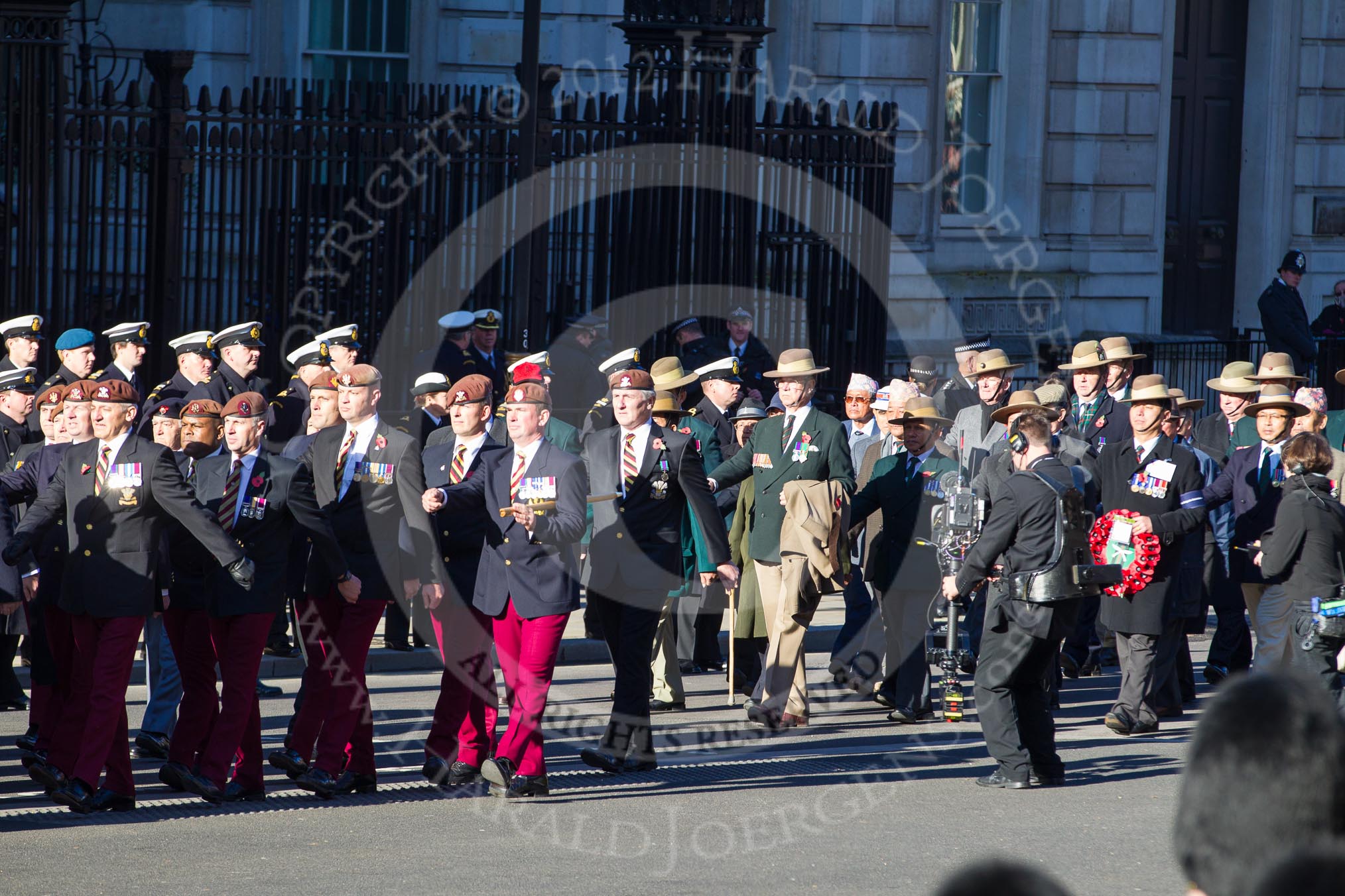 Remembrance Sunday 2012 Cenotaph March Past: Group B12 - Kings Royal Hussars Regimental Association and B13 - Gurkha Brigade Association..
Whitehall, Cenotaph,
London SW1,

United Kingdom,
on 11 November 2012 at 11:56, image #883