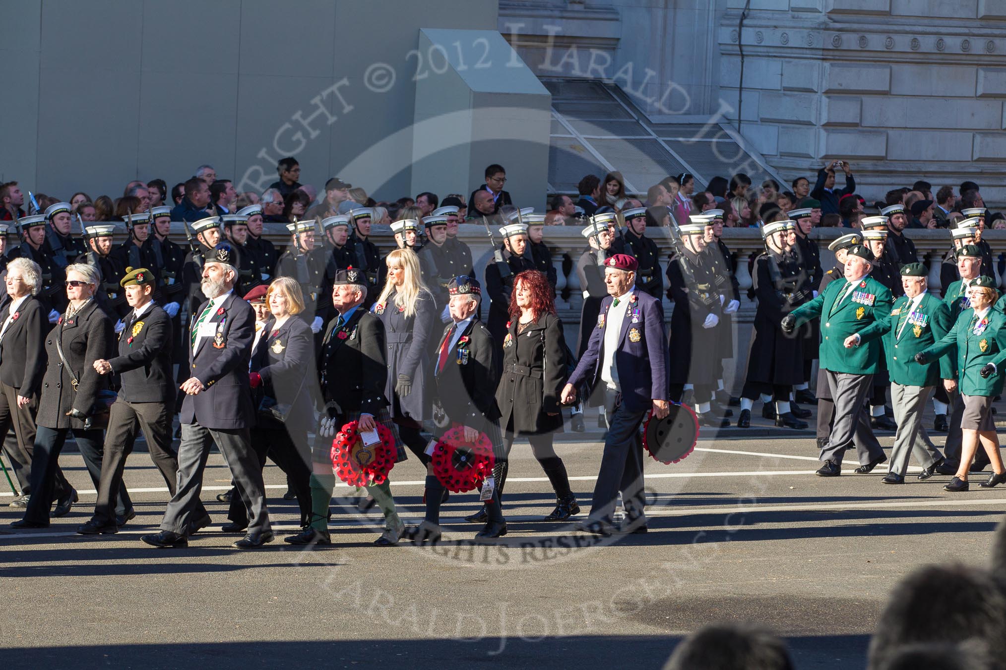 Remembrance Sunday 2012 Cenotaph March Past: Group D18 - The Royal British Legion Scotland and D19 - Ulster Defence Regiment..
Whitehall, Cenotaph,
London SW1,

United Kingdom,
on 11 November 2012 at 12:08, image #1375