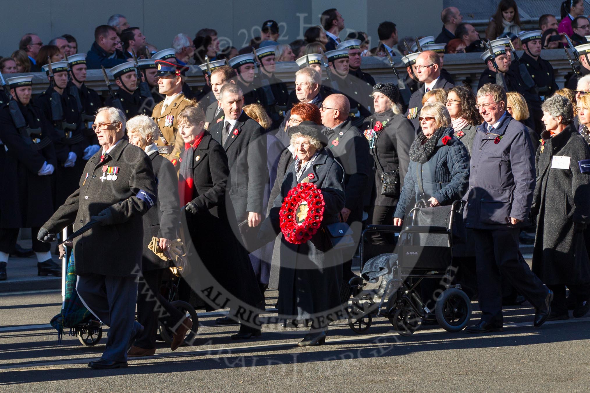 Remembrance Sunday 2012 Cenotaph March Past: Group M4 - Munitions Workers Association..
Whitehall, Cenotaph,
London SW1,

United Kingdom,
on 11 November 2012 at 12:09, image #1446