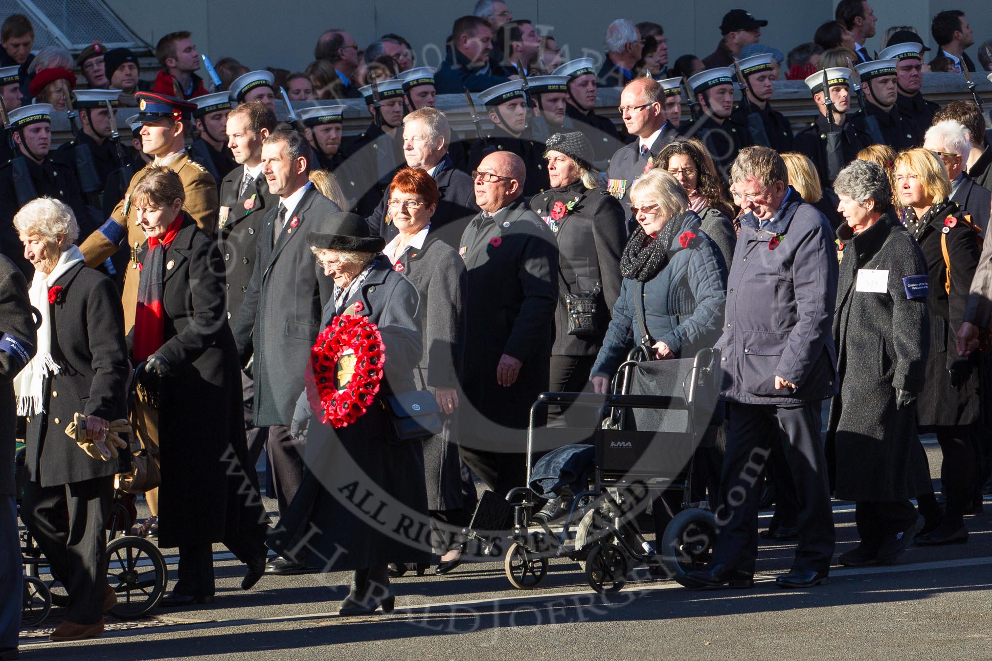 Remembrance Sunday 2012 Cenotaph March Past: Group M4 - Munitions Workers Association and M5  - Children of the Far East Prisoners of War..
Whitehall, Cenotaph,
London SW1,

United Kingdom,
on 11 November 2012 at 12:09, image #1450