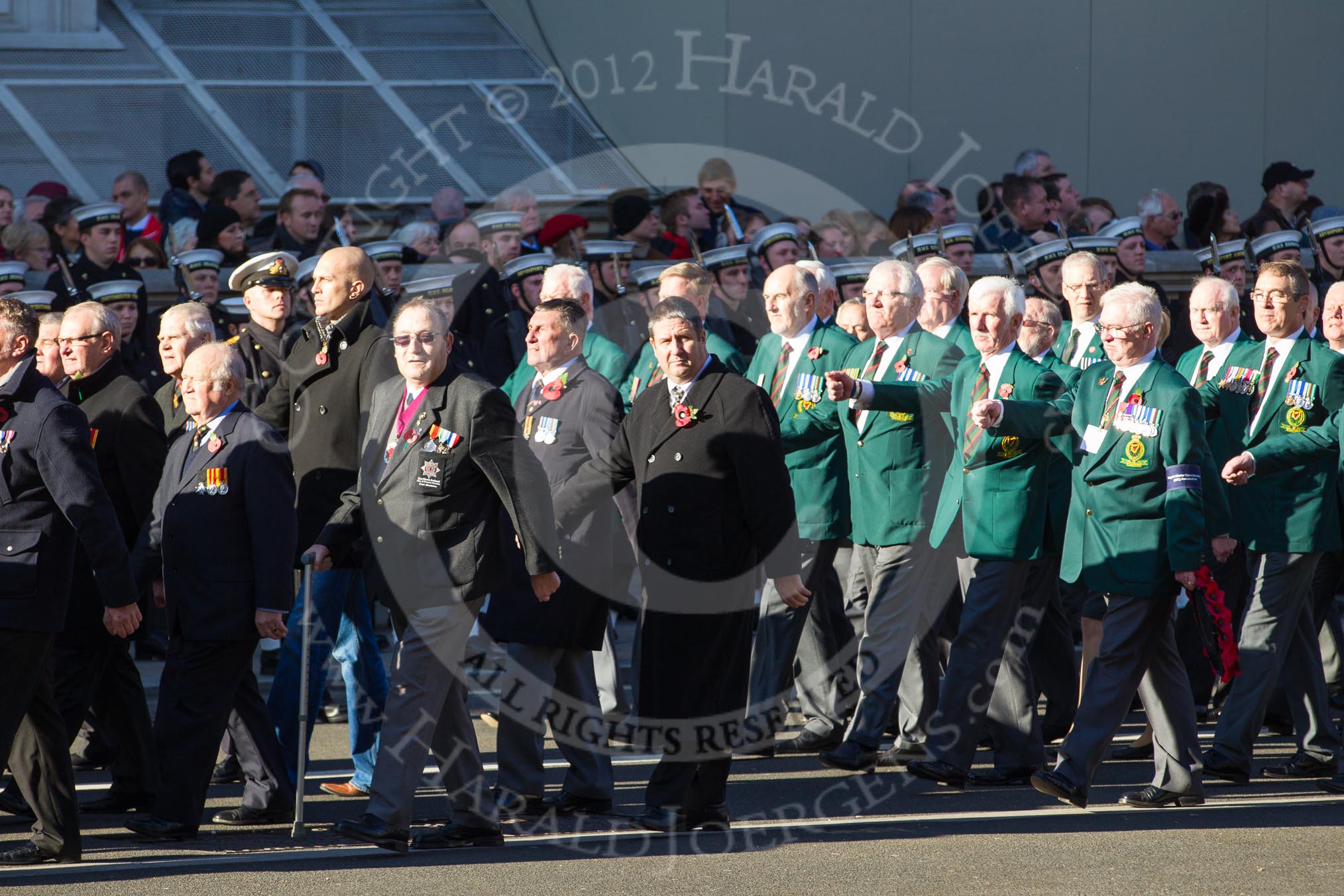 Remembrance Sunday 2012 Cenotaph March Past: Group M18 - Firefighters Memorial Charitable Trust, and M19 - Royal Ulster Constabulary (GC) Association..
Whitehall, Cenotaph,
London SW1,

United Kingdom,
on 11 November 2012 at 12:12, image #1546