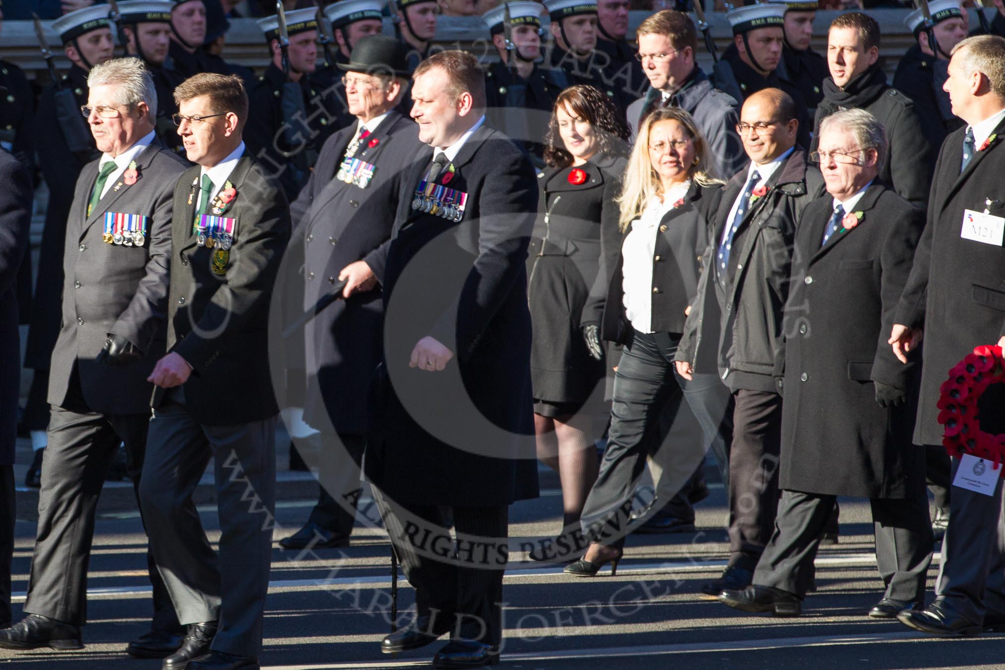 Remembrance Sunday 2012 Cenotaph March Past: Group M20 - Ulster Special Constabulary Association and M21 - Commonwealth War Graves Commission..
Whitehall, Cenotaph,
London SW1,

United Kingdom,
on 11 November 2012 at 12:12, image #1562