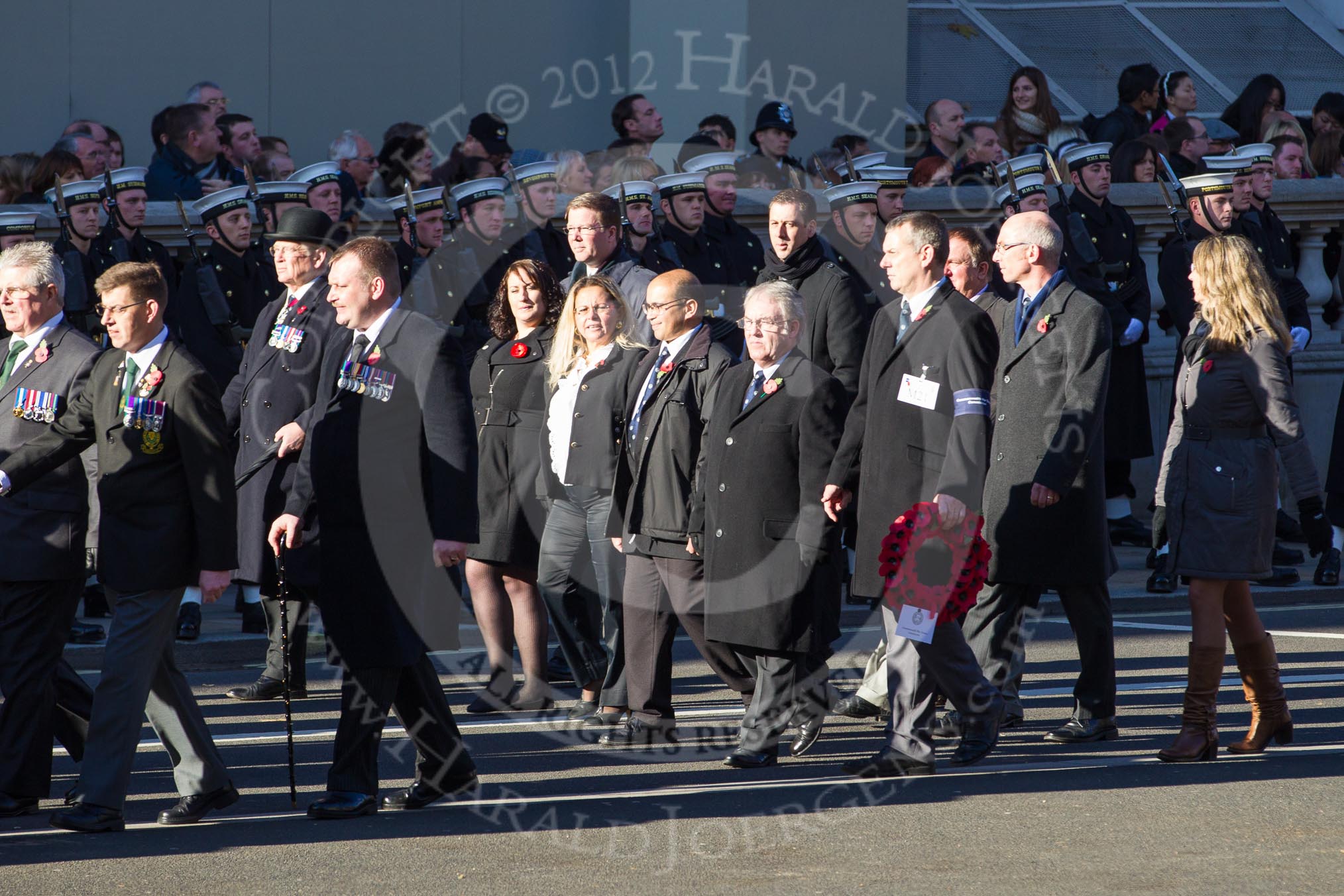 Remembrance Sunday 2012 Cenotaph March Past: Group M20 - Ulster Special Constabulary Association and M21 - Commonwealth War Graves Commission..
Whitehall, Cenotaph,
London SW1,

United Kingdom,
on 11 November 2012 at 12:12, image #1563