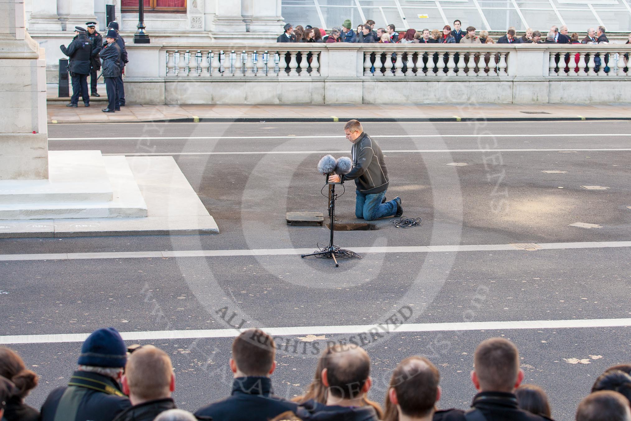 Setting up the microphones for the service that will be given later - technician at work next to the Cenotaph.