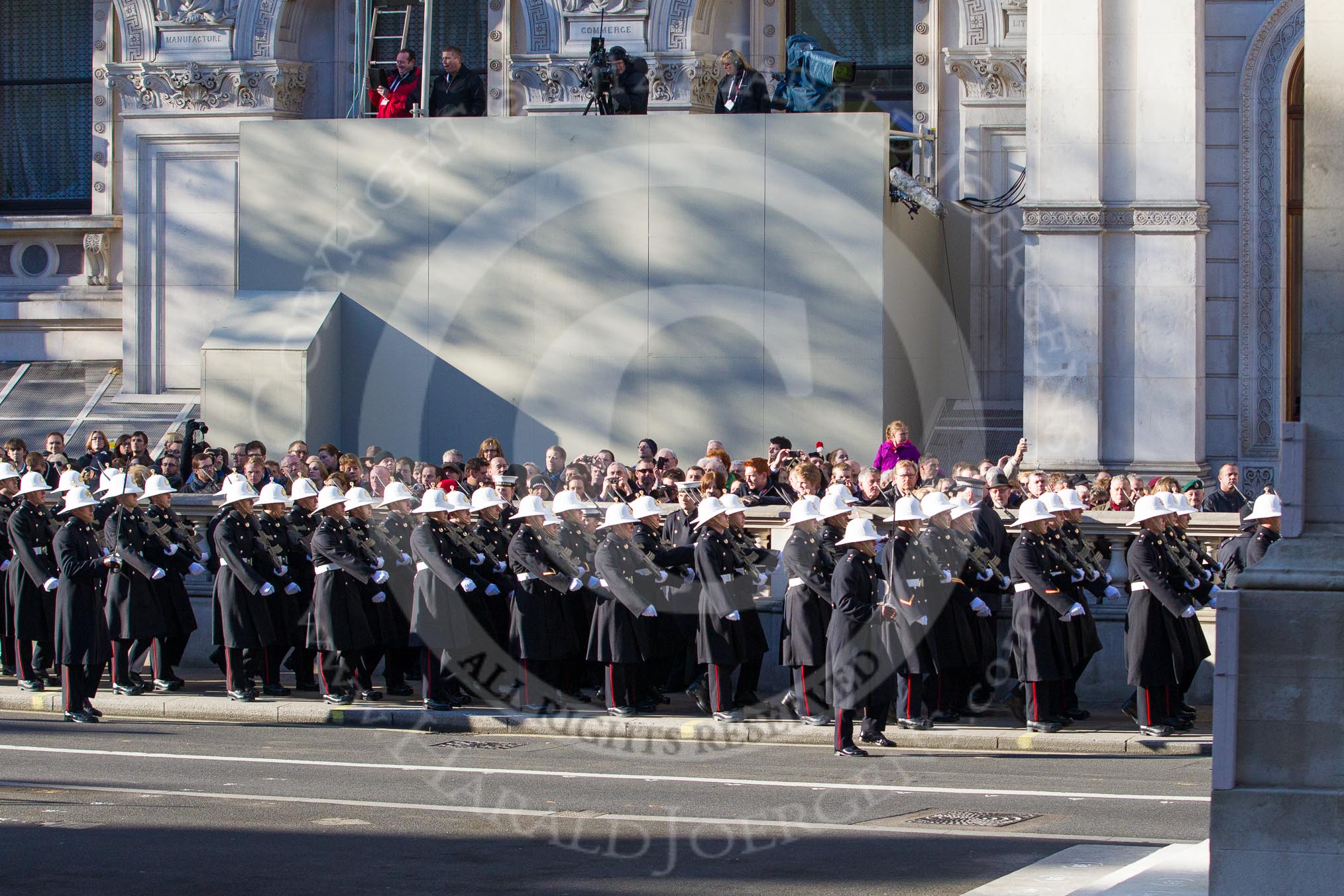 A detachment from from the Royal Marines passing the Cenotaph on the northern side of Whitehall.