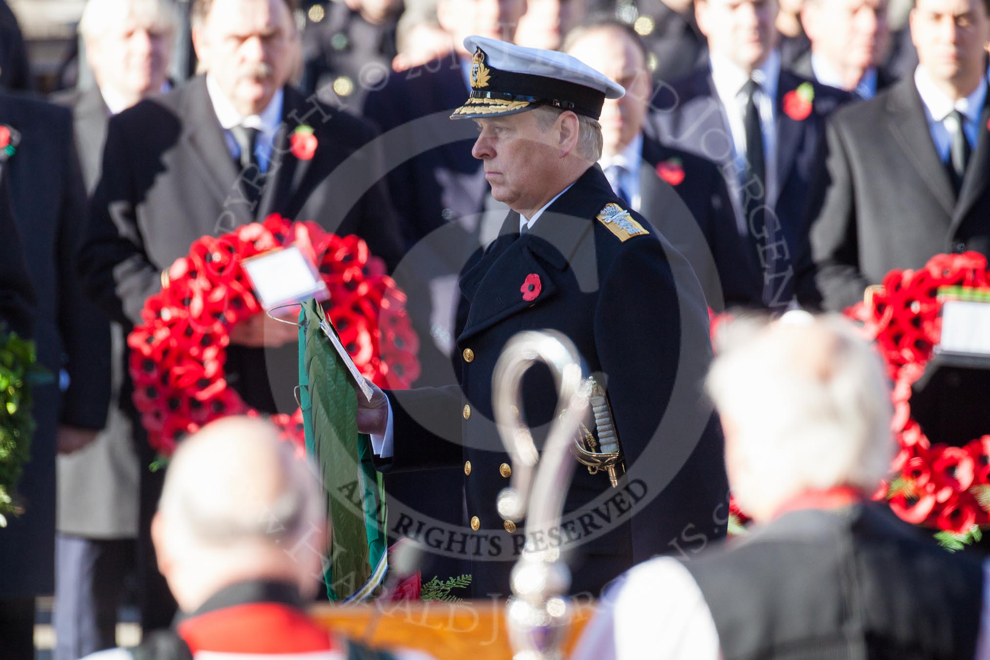 HRH The Duke of York, about to lay his wreath at the Cenotaph. In the foreground, and out of focus, the Bishop of London.
