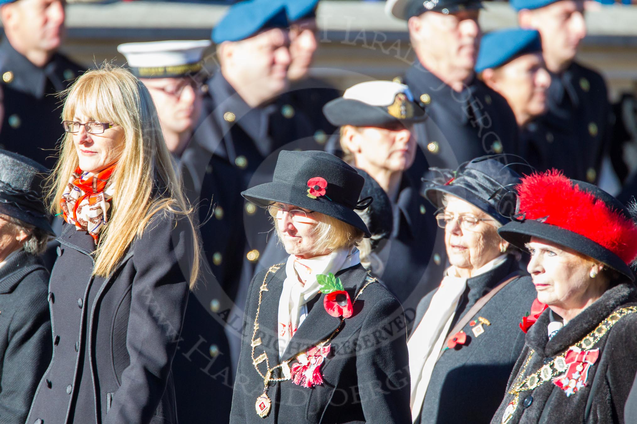 Remembrance Sunday Cenotaph March Past 2013: D1 - War Widows Association. The lady with the chain a black hat with the poppy in it is Chairman Rosalind Campbell. On the right, with the red fur round her hat, is President Baroness Janet Fookes. The lady on the left, with the long blond hair is, Lesley-Ann George-Taylor, Chairman of the Royal Navy and Royal Marines Widows Association.
Press stand opposite the Foreign Office building, Whitehall, London SW1,
London,
Greater London,
United Kingdom,
on 10 November 2013 at 11:38, image #18