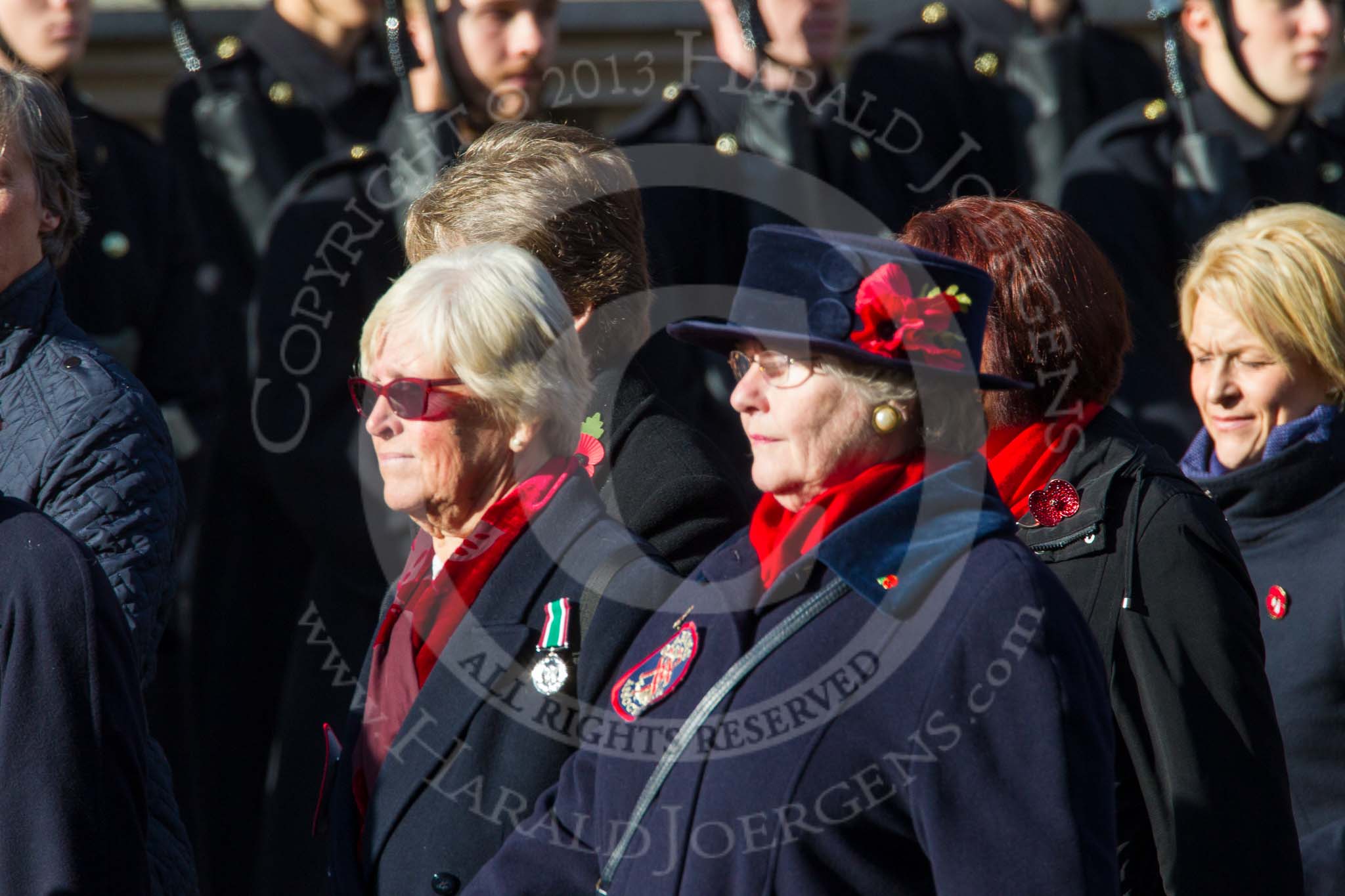 Remembrance Sunday at the Cenotaph in London 2014: Group E24 - Queen Alexandra's Royal Naval Nursing Service.
Press stand opposite the Foreign Office building, Whitehall, London SW1,
London,
Greater London,
United Kingdom,
on 09 November 2014 at 11:53, image #756
