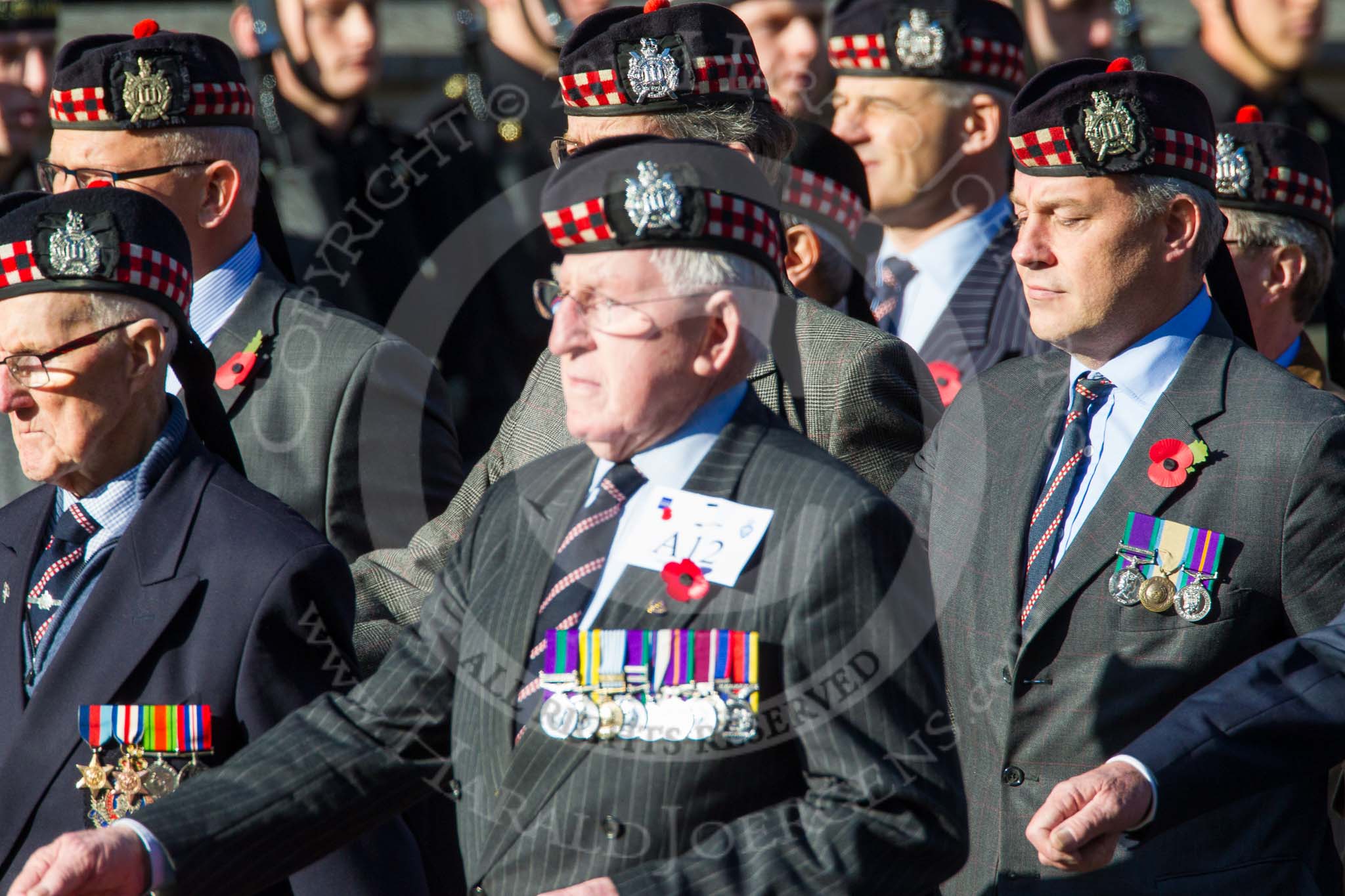 Remembrance Sunday at the Cenotaph in London 2014: Group A12 - King's Own Scottish Borderers.
Press stand opposite the Foreign Office building, Whitehall, London SW1,
London,
Greater London,
United Kingdom,
on 09 November 2014 at 12:02, image #1256