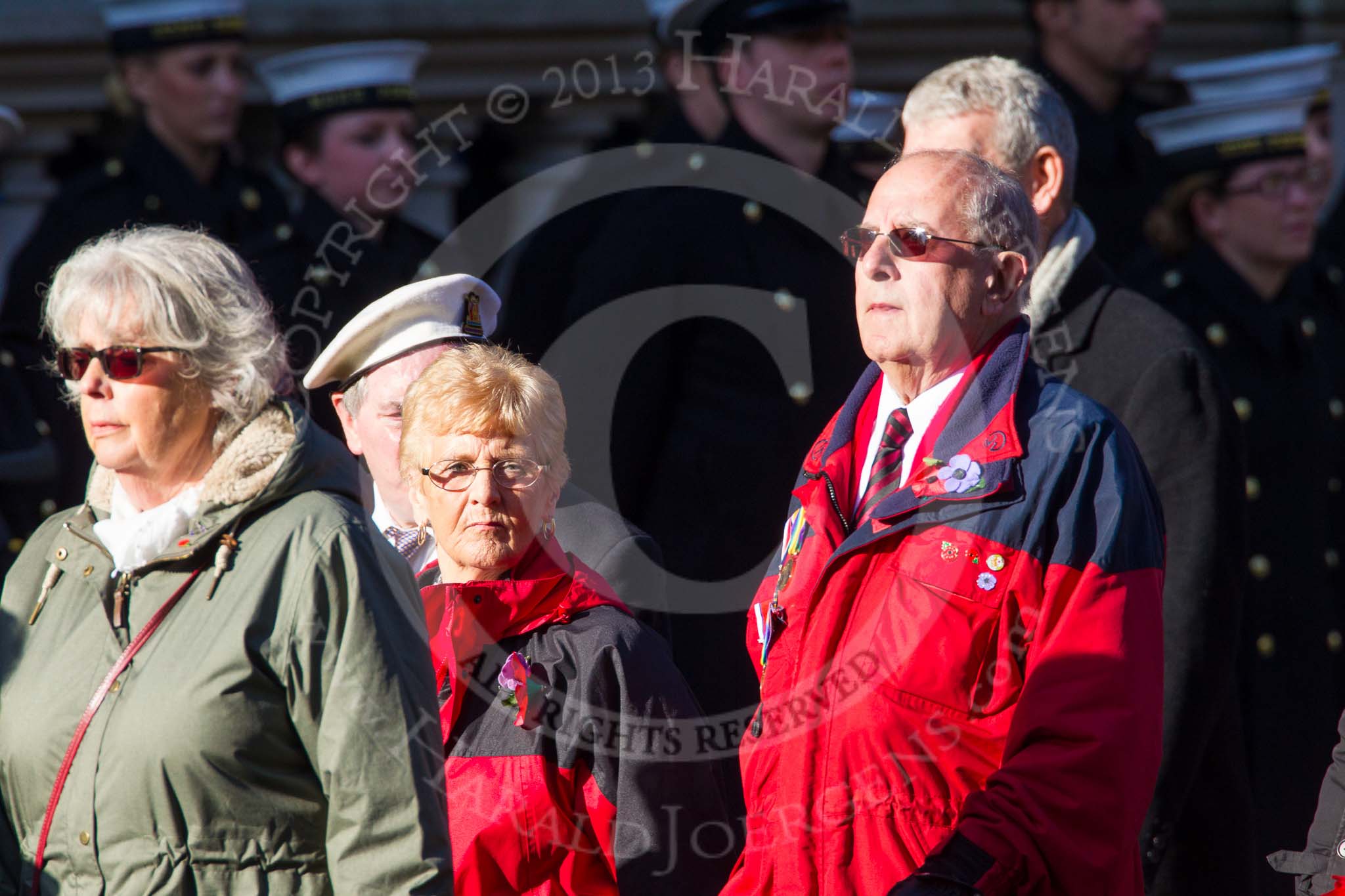 Remembrance Sunday at the Cenotaph in London 2014: Group M23 - Civilians Representing Families.
Press stand opposite the Foreign Office building, Whitehall, London SW1,
London,
Greater London,
United Kingdom,
on 09 November 2014 at 12:18, image #2166