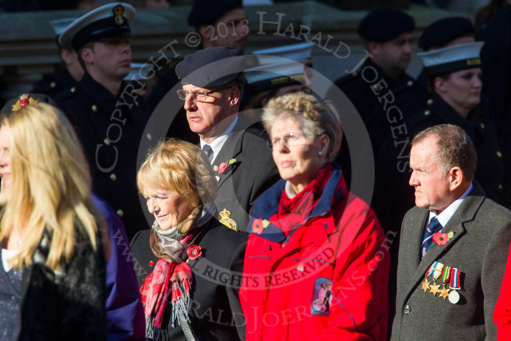 Remembrance Sunday at the Cenotaph in London 2014: Group M23 - Civilians Representing Families.
Press stand opposite the Foreign Office building, Whitehall, London SW1,
London,
Greater London,
United Kingdom,
on 09 November 2014 at 12:18, image #2173