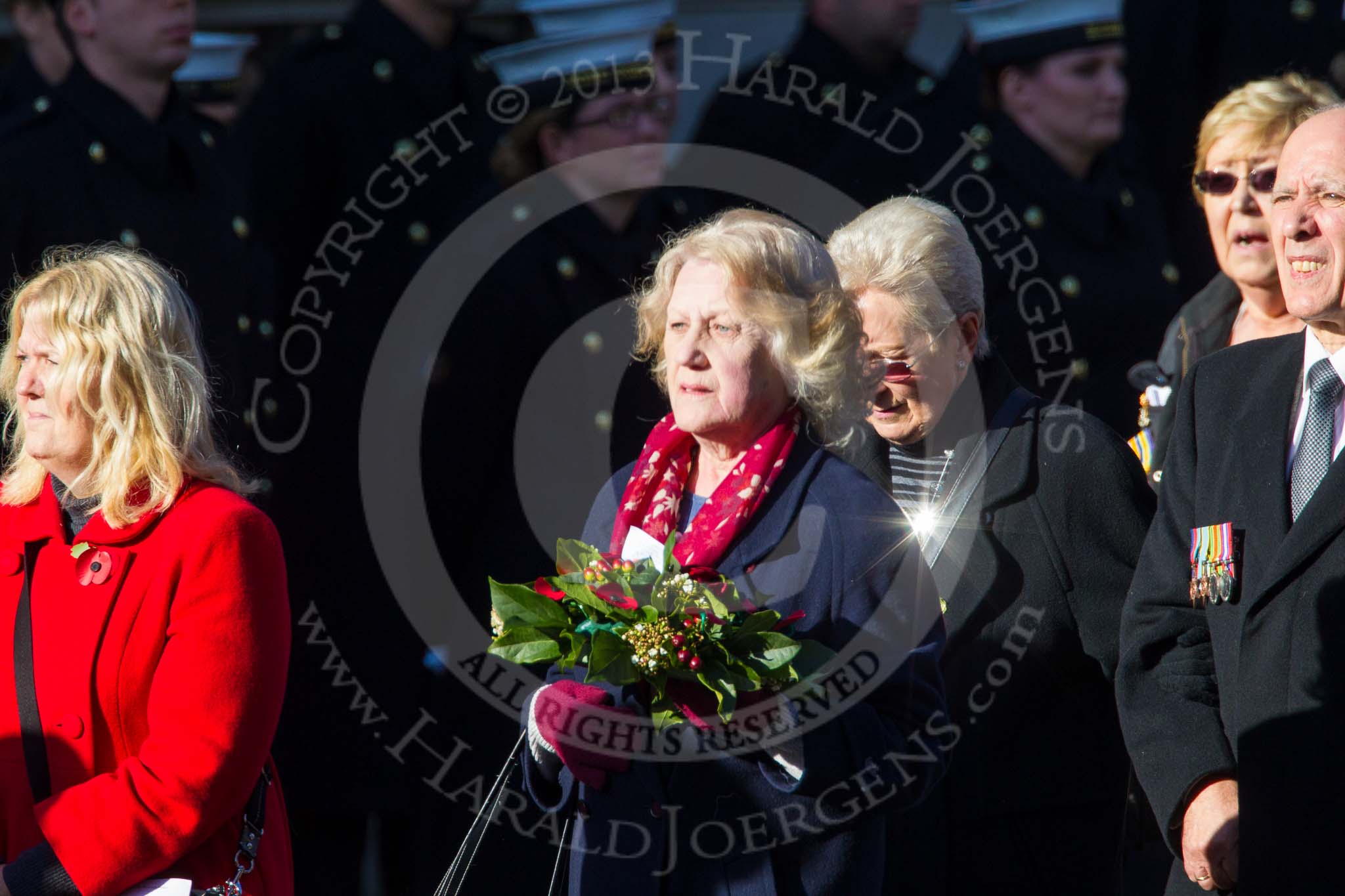 Remembrance Sunday at the Cenotaph in London 2014: Group M23 - Civilians Representing Families.
Press stand opposite the Foreign Office building, Whitehall, London SW1,
London,
Greater London,
United Kingdom,
on 09 November 2014 at 12:18, image #2175