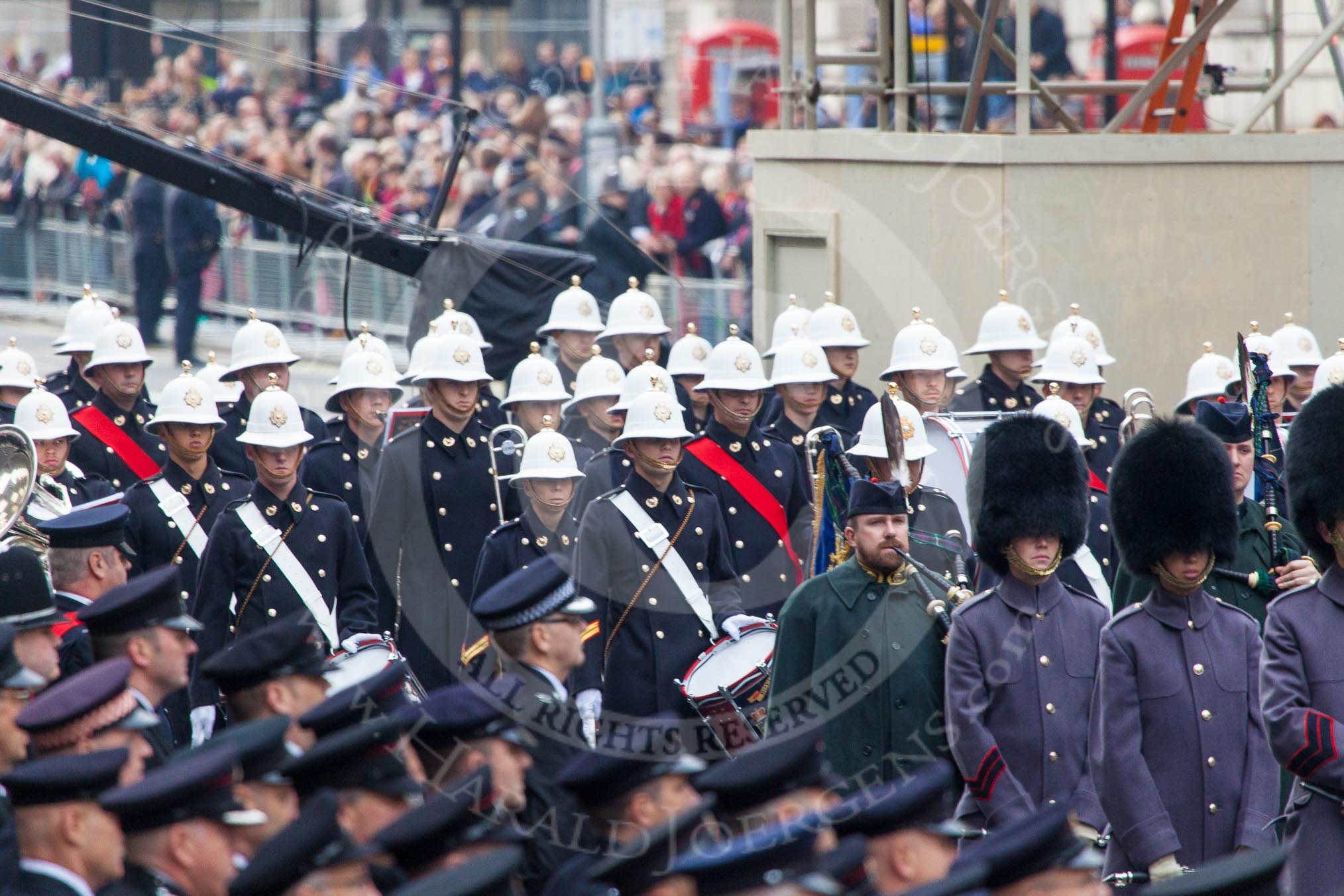 Remembrance Sunday at the Cenotaph in London 2014: The Band of the Royal Marines is following the Pipes and Drums onto Whitehall.
Press stand opposite the Foreign Office building, Whitehall, London SW1,
London,
Greater London,
United Kingdom,
on 09 November 2014 at 10:33, image #76