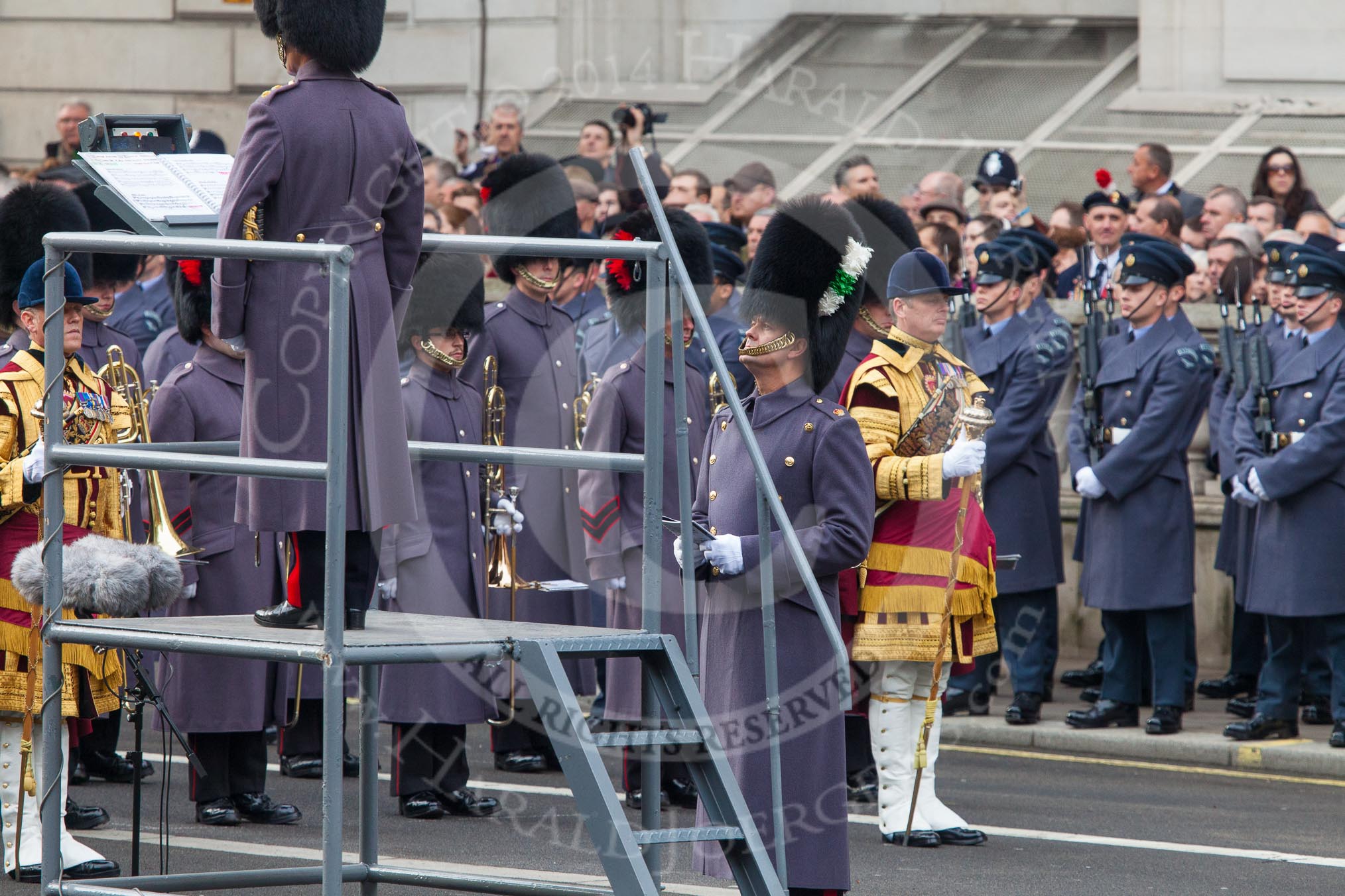 Remembrance Sunday at the Cenotaph in London 2014: The Household Division bands and the Director of Music, getting ready for the event.
Press stand opposite the Foreign Office building, Whitehall, London SW1,
London,
Greater London,
United Kingdom,
on 09 November 2014 at 10:35, image #78