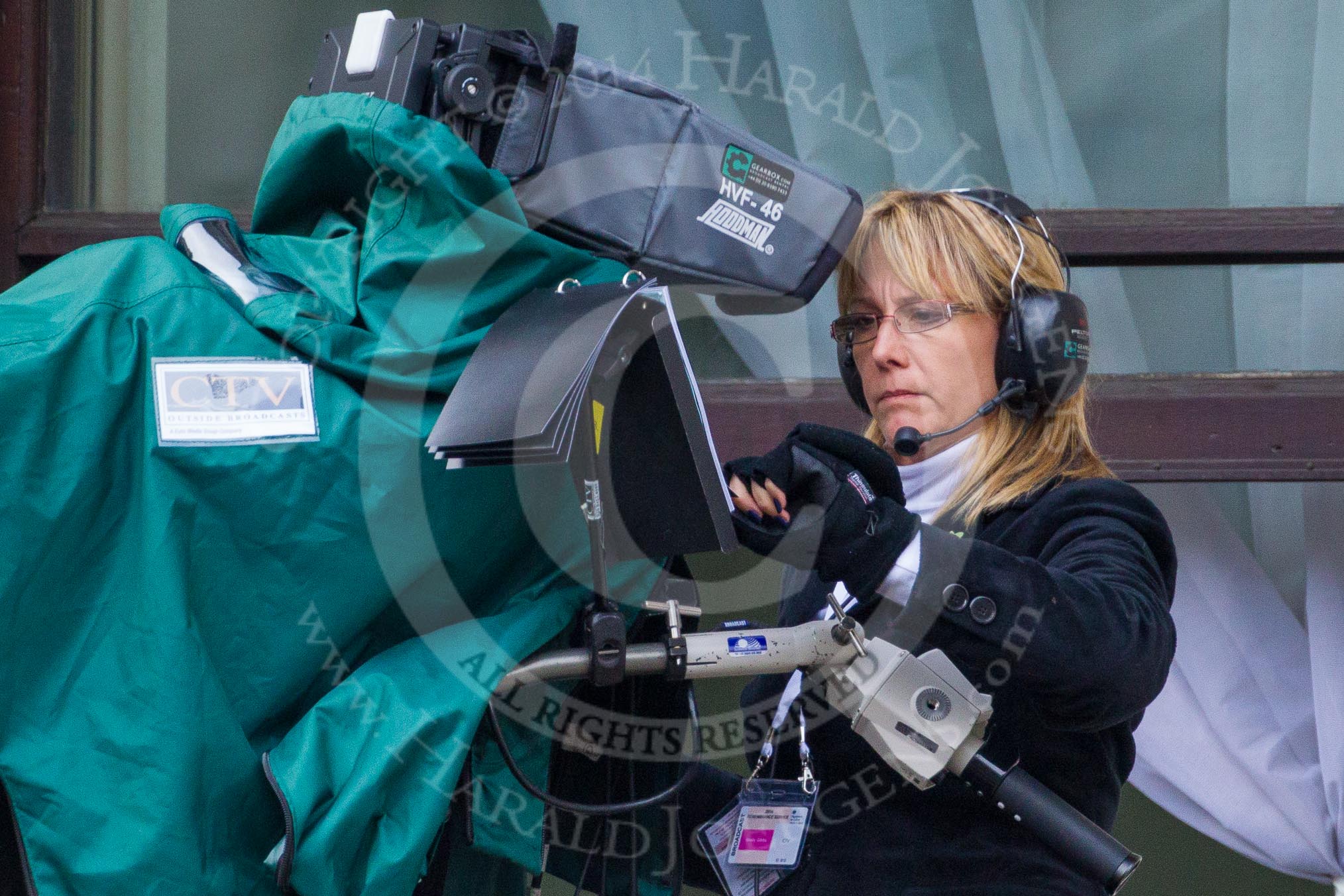 Remembrance Sunday at the Cenotaph in London 2014: A BBC caremawoman at the Foreign- and Commonwealth Office.
Press stand opposite the Foreign Office building, Whitehall, London SW1,
London,
Greater London,
United Kingdom,
on 09 November 2014 at 10:41, image #84