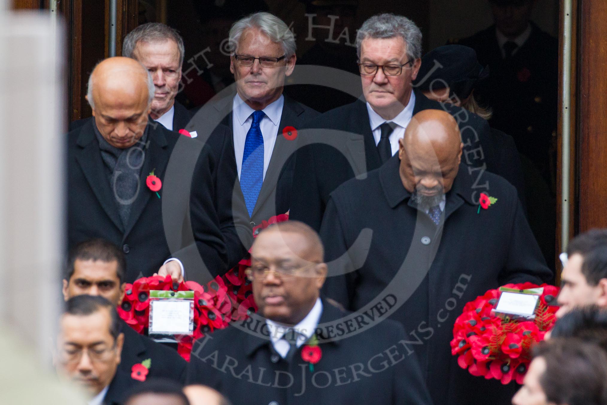 Remembrance Sunday at the Cenotaph in London 2014: The High Commissioners emerging from the door of the Foreign- and Commonwealth Office.
Press stand opposite the Foreign Office building, Whitehall, London SW1,
London,
Greater London,
United Kingdom,
on 09 November 2014 at 10:56, image #136