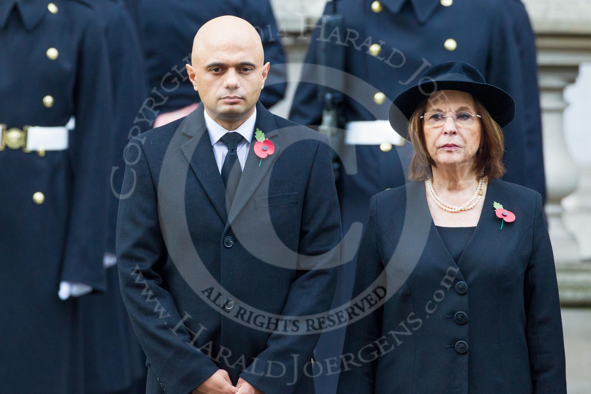 Remembrance Sunday at the Cenotaph in London 2014: Culture Secretary Sajid Javid and the Lord Speaker, Baroness D'Souza.
Press stand opposite the Foreign Office building, Whitehall, London SW1,
London,
Greater London,
United Kingdom,
on 09 November 2014 at 11:02, image #161