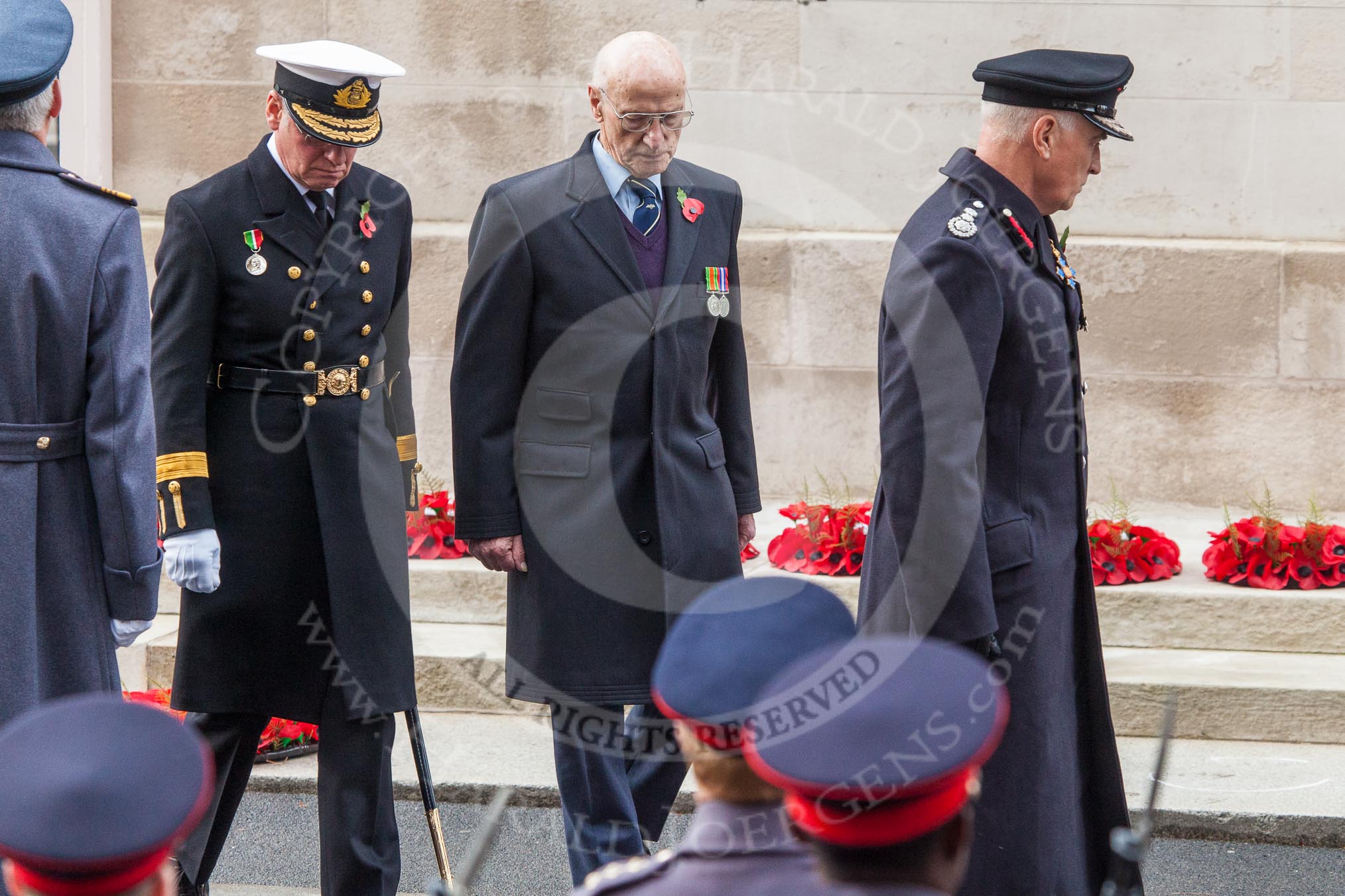 Remembrance Sunday at the Cenotaph in London 2014: Captain Ian McNaught as representative of the Merchant Navy and Fishing Fleets, Mr Martin R Nicholson for the Air Transport Auxiliary Association , and Peter Holland, HM Government’s Chief Fire and Rescue Advisor, after laying their wreaths at the Cenotaph.
Press stand opposite the Foreign Office building, Whitehall, London SW1,
London,
Greater London,
United Kingdom,
on 09 November 2014 at 11:15, image #263