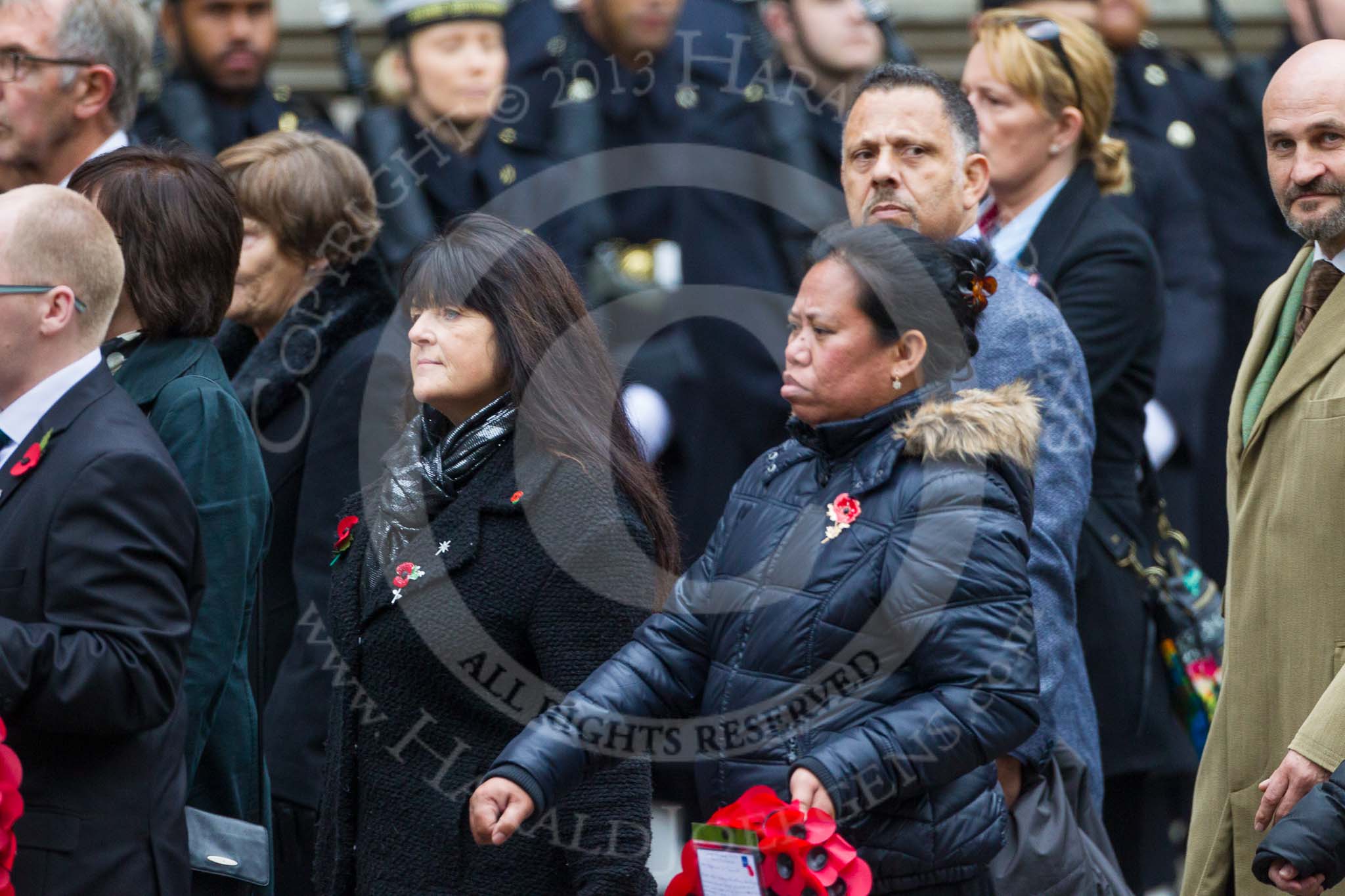 Remembrance Sunday at the Cenotaph 2015: Group M23, Civilians Representing Families.
Cenotaph, Whitehall, London SW1,
London,
Greater London,
United Kingdom,
on 08 November 2015 at 12:17, image #1569