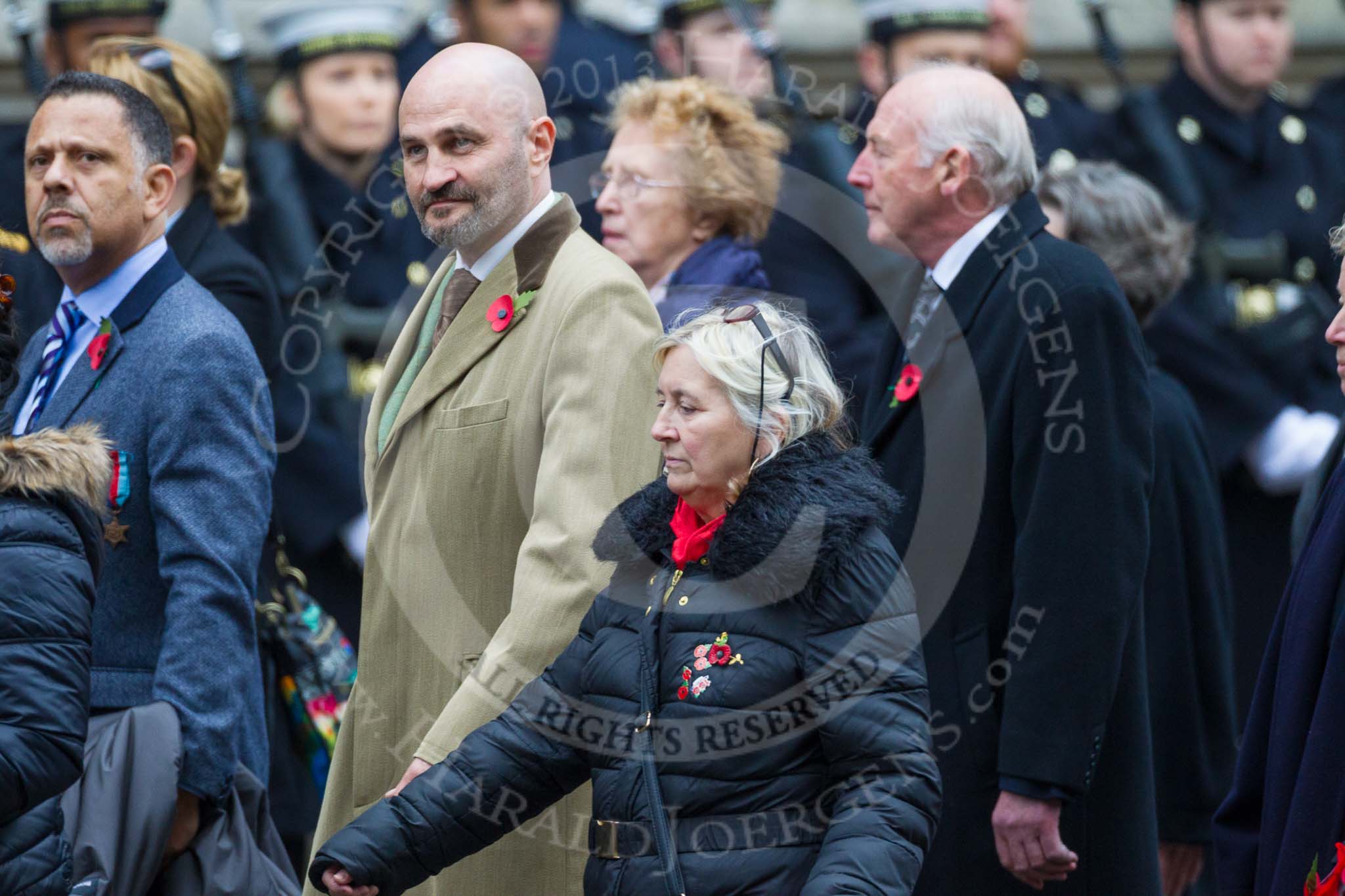 Remembrance Sunday at the Cenotaph 2015: Group M23, Civilians Representing Families.
Cenotaph, Whitehall, London SW1,
London,
Greater London,
United Kingdom,
on 08 November 2015 at 12:17, image #1571