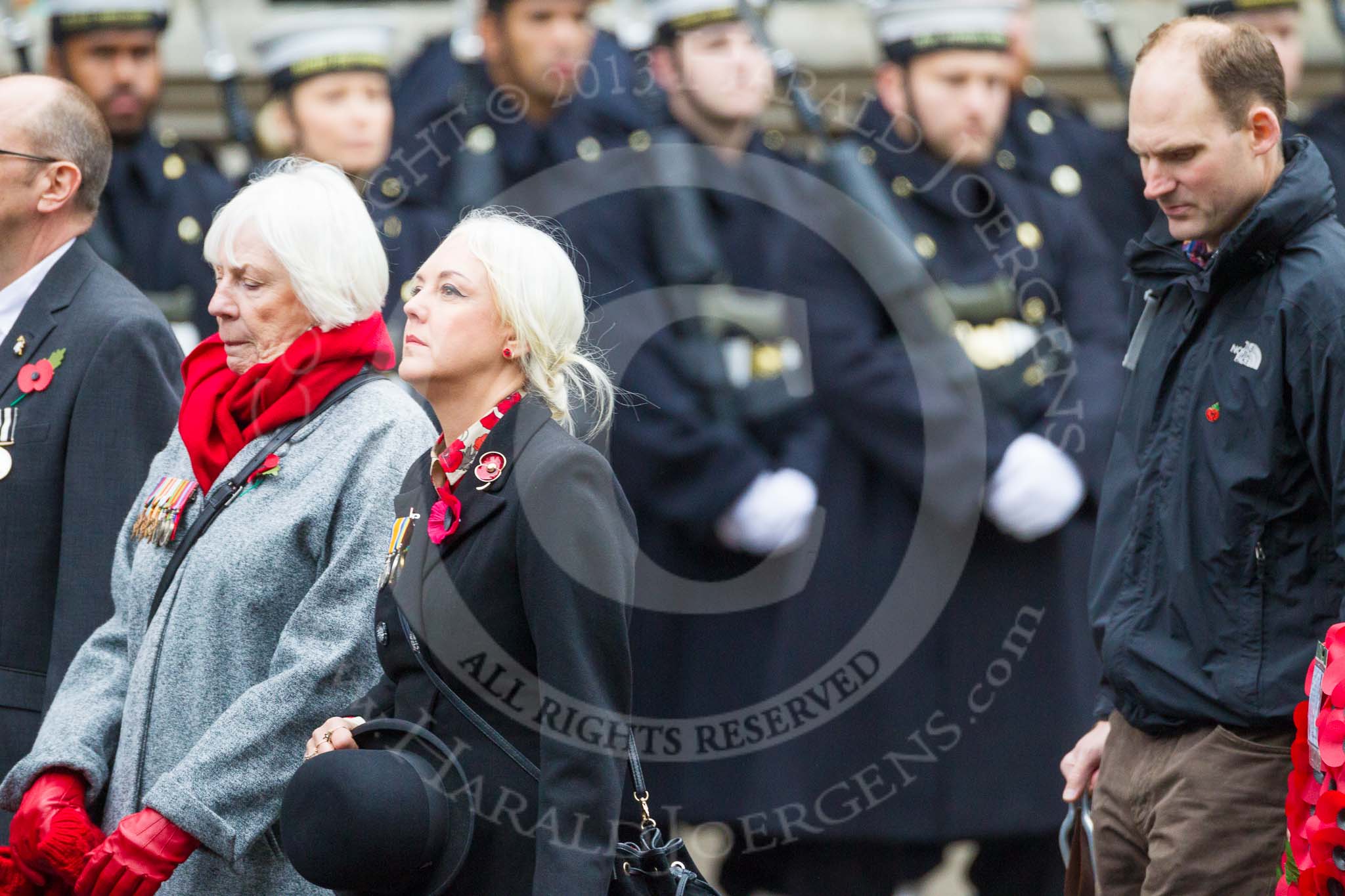 Remembrance Sunday at the Cenotaph 2015: Group M23, Civilians Representing Families.
Cenotaph, Whitehall, London SW1,
London,
Greater London,
United Kingdom,
on 08 November 2015 at 12:17, image #1588