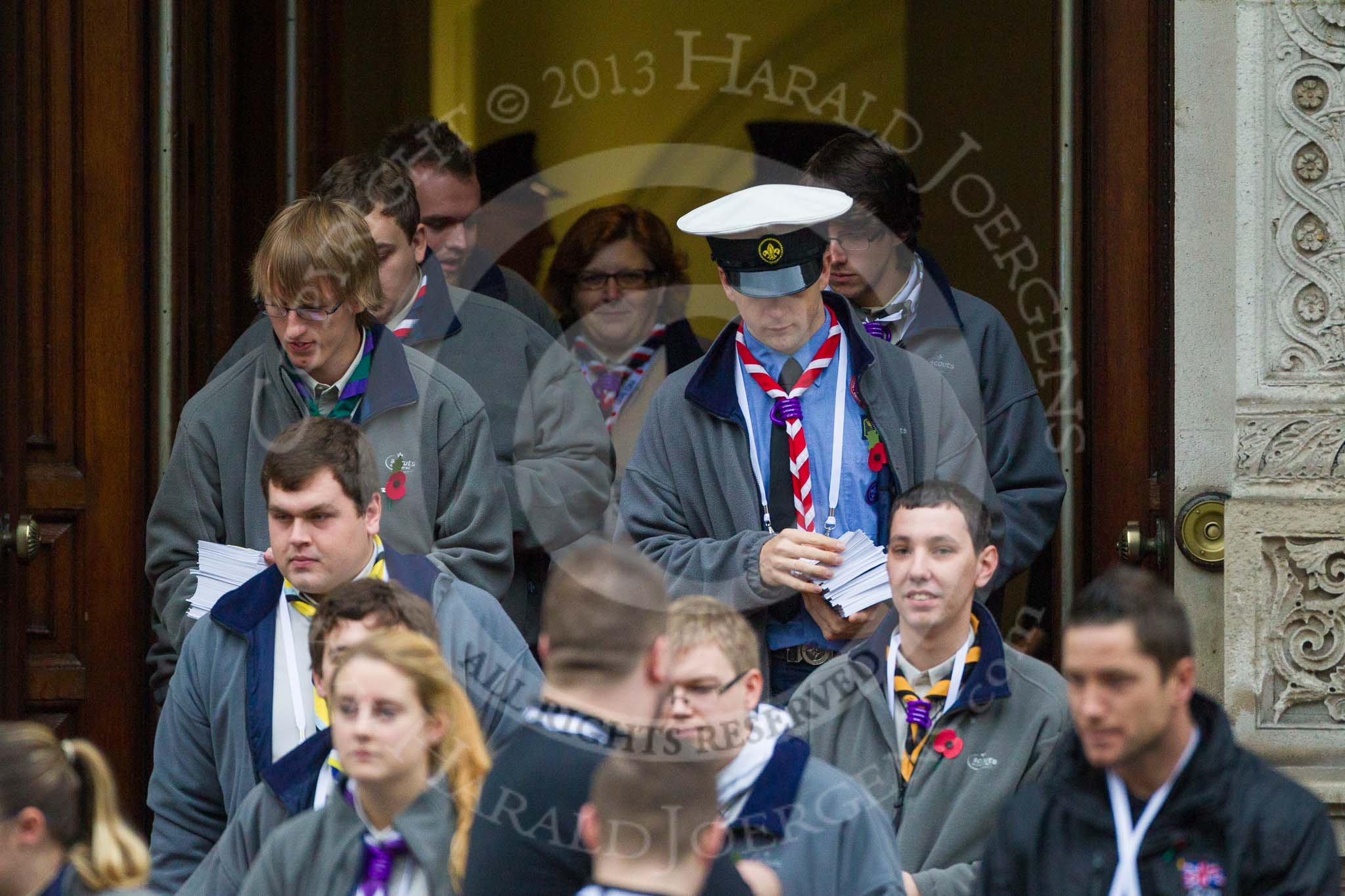 Remembrance Sunday at the Cenotaph 2015: The Queen's Scouts emerging from the Foreign- and Commonwealth Office to distribute leaflets with information about the service. Image #10, 08 November 2015 09:11 Whitehall, London, UK