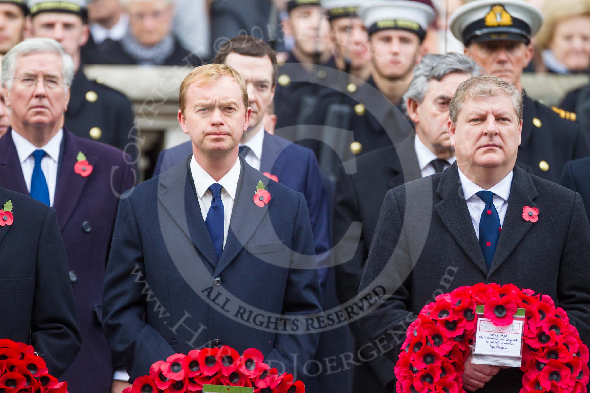 Remembrance Sunday at the Cenotaph 2015: The Leader of the Liberal Democrats, Tim Fallon, and the Westminster Leader of the Scottish National Party, Angus Robertson. Behind them the Secretary of State for Defence, Michael Fallon, the Chancellor of the Exchequer, George Osborne, and former prime ministers Gordon Brown. Image #155, 08 November 2015 11:02 Whitehall, London, UK