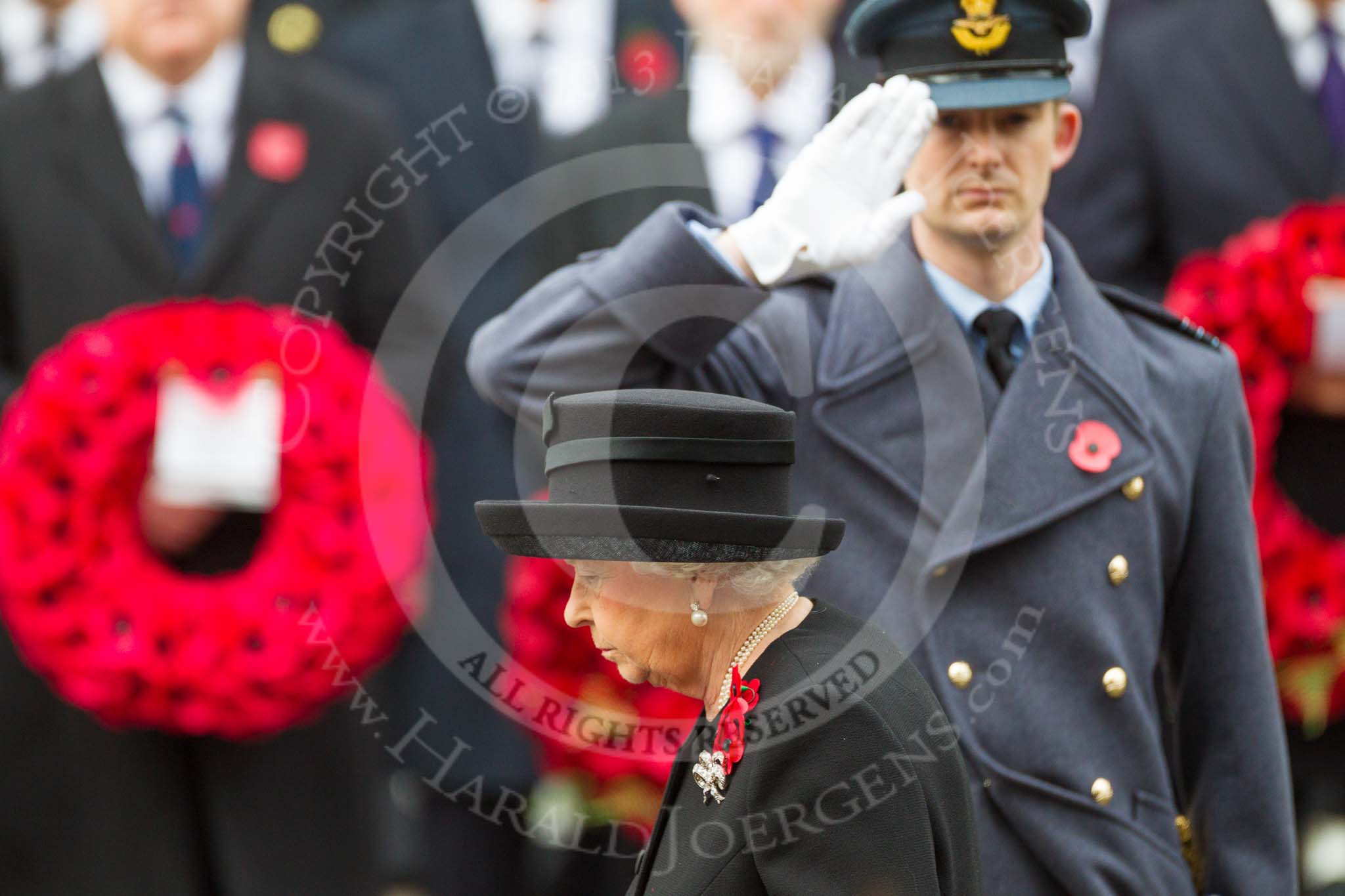 Remembrance Sunday at the Cenotaph 2015: The Equerry to HM The Queen, Wing Commander Sam Fletcher, RAF, saluting after handing over the wreath. Image #172, 08 November 2015 11:03 Whitehall, London, UK