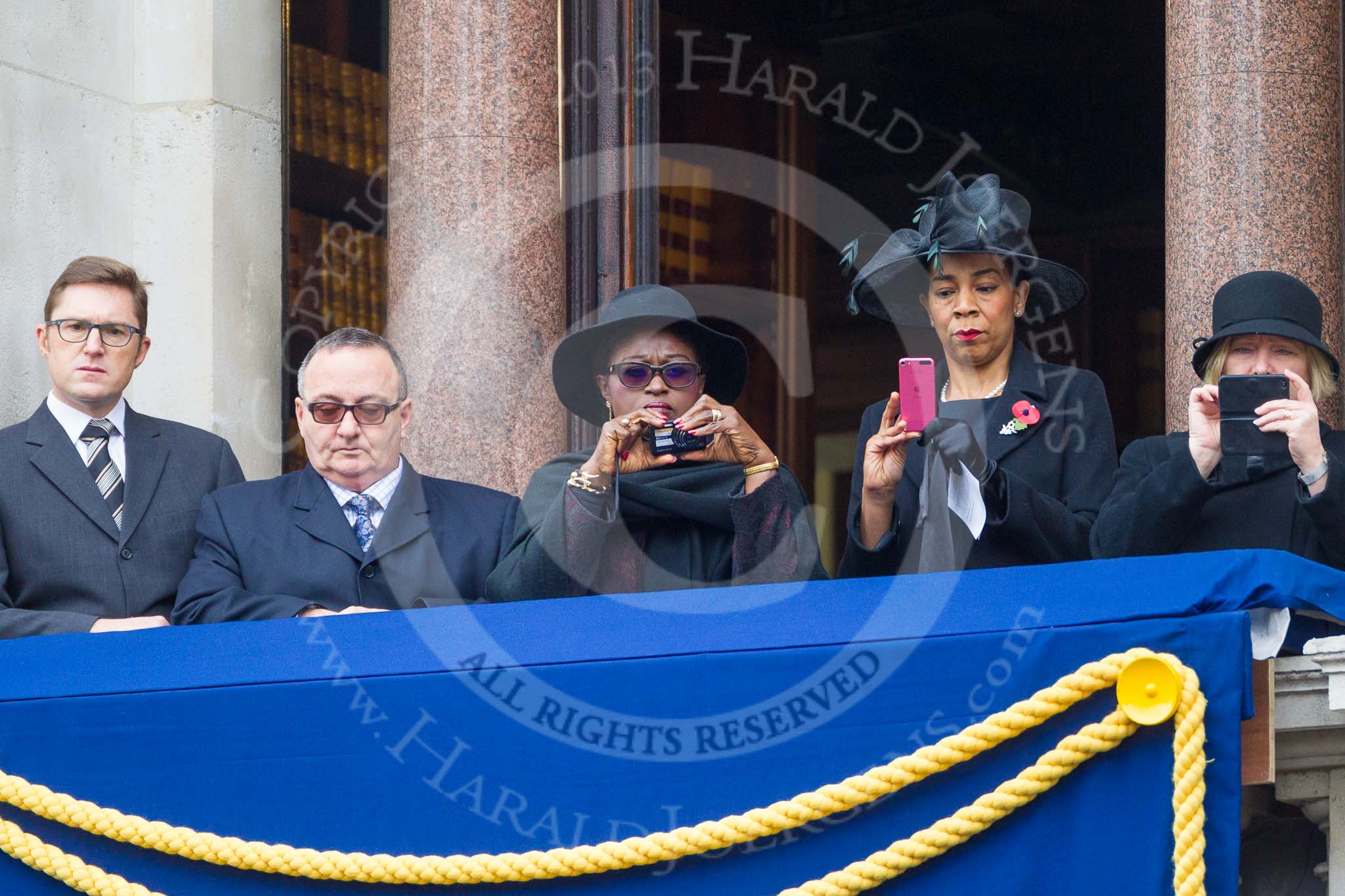 Remembrance Sunday at the Cenotaph 2015: Guests watching the ceremony from one of the balconies of the Foreign- and Commonwealth Office. Image #255, 08 November 2015 11:11 Whitehall, London, UK