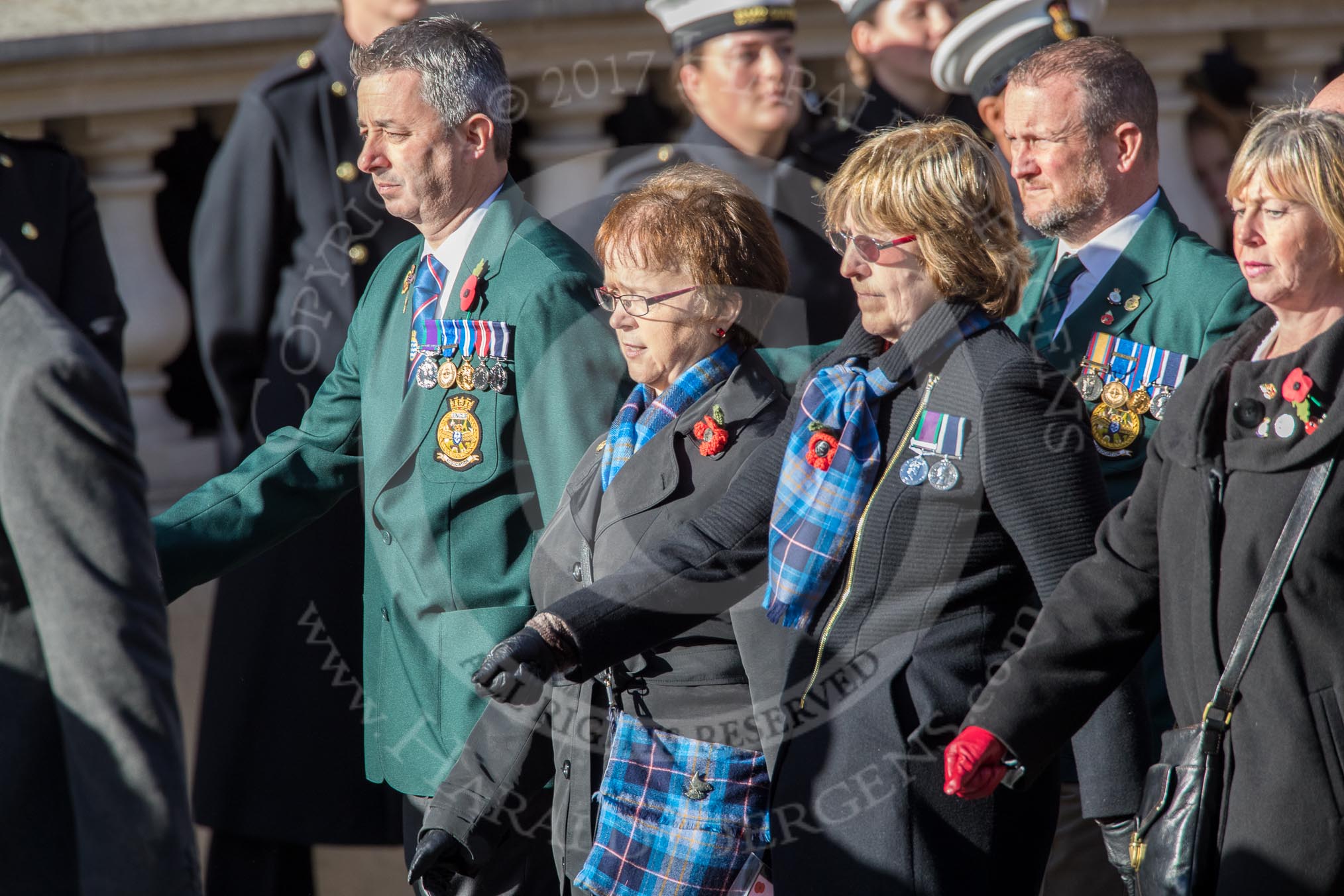 Fleet Air Arm Junglies Association  (Group E12, 22 members) during the Royal British Legion March Past on Remembrance Sunday at the Cenotaph, Whitehall, Westminster, London, 11 November 2018, 11:43.