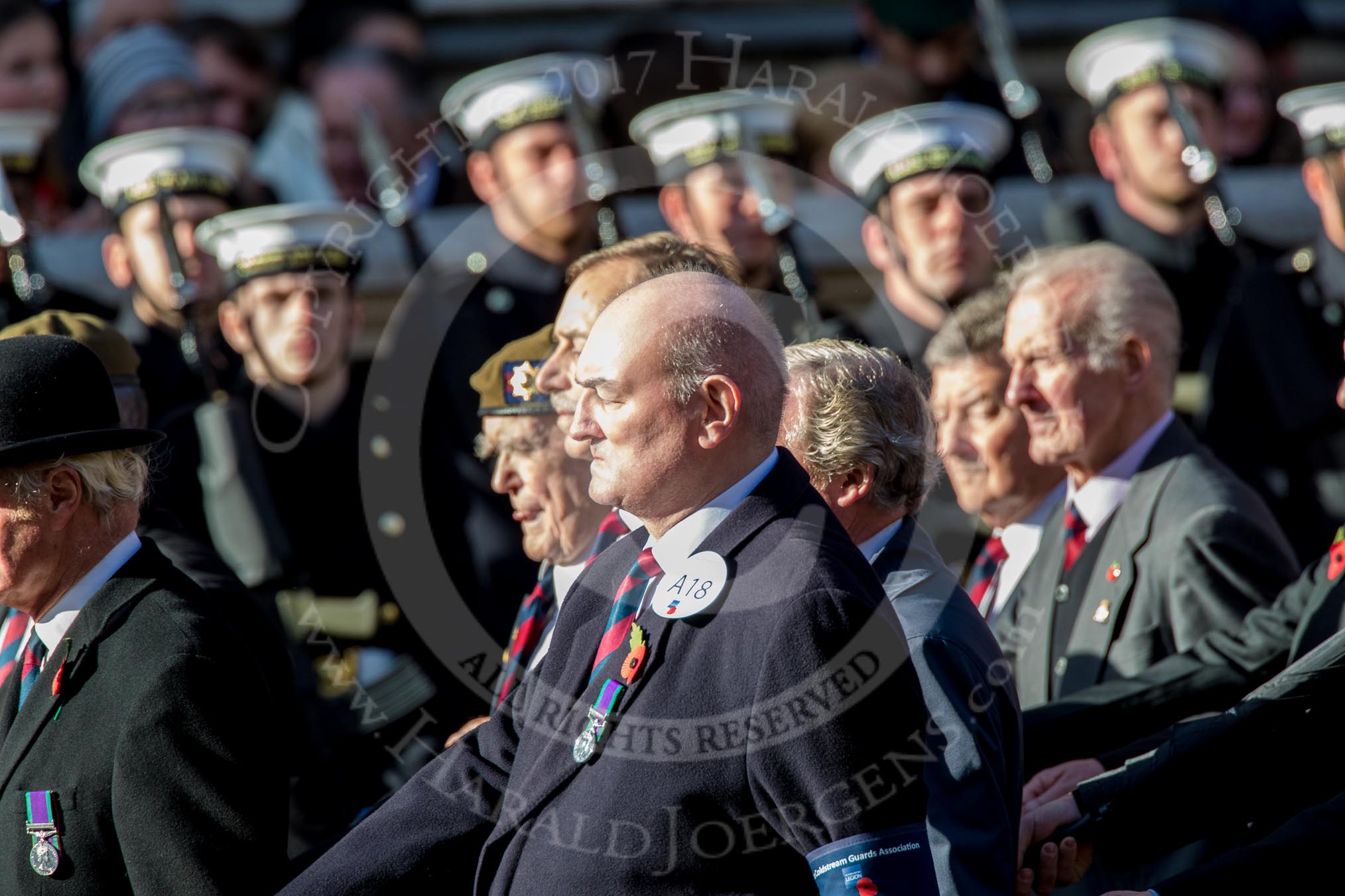 Coldstream Guards Association (Group A18, 30 members) during the Royal British Legion March Past on Remembrance Sunday at the Cenotaph, Whitehall, Westminster, London, 11 November 2018, 11:58.