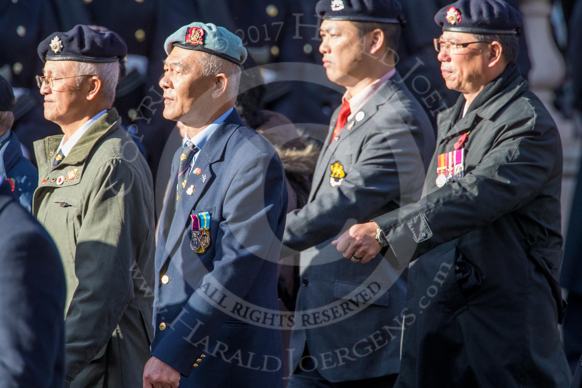 The Hong Kong Ex-Servicemen's Association  (UK Branch) (Group D22, 24 members) during the Royal British Legion March Past on Remembrance Sunday at the Cenotaph, Whitehall, Westminster, London, 11 November 2018, 12:24.