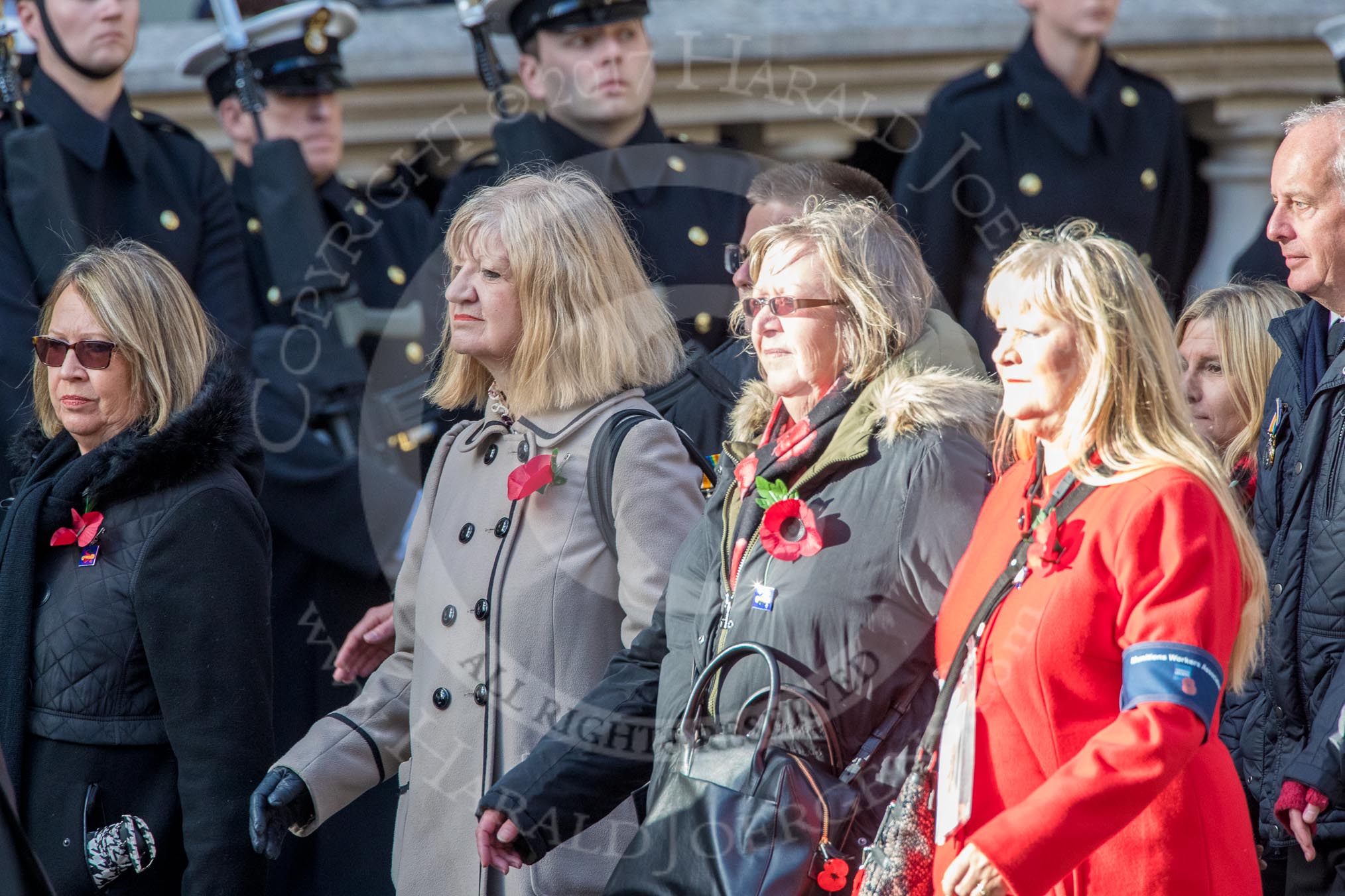 Munitions Workers Association (Group M3, 21 members) during the Royal British Legion March Past on Remembrance Sunday at the Cenotaph, Whitehall, Westminster, London, 11 November 2018, 12:25.
