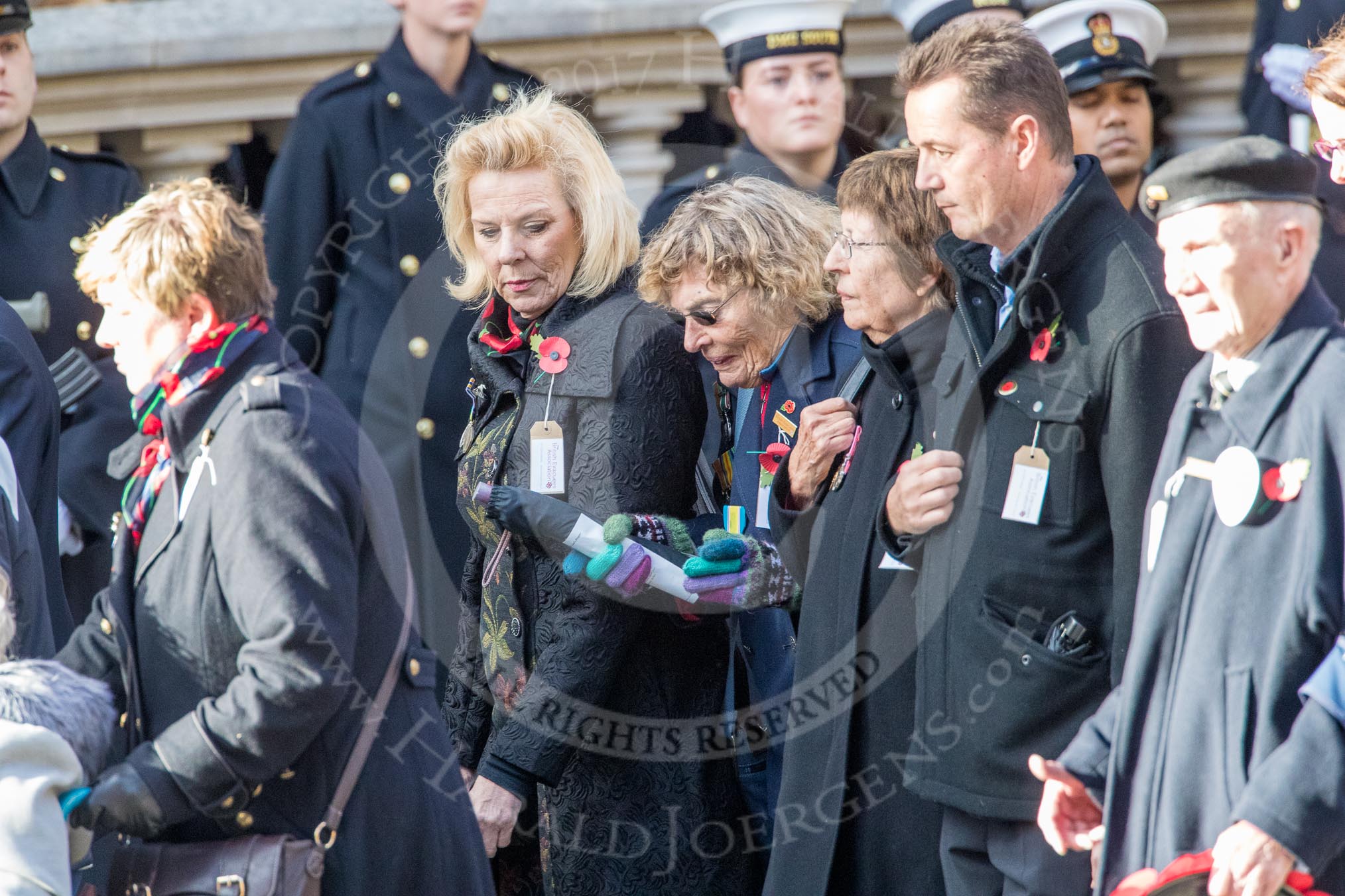 The British Evacuees Association (Group M4, 50 members) during the Royal British Legion March Past on Remembrance Sunday at the Cenotaph, Whitehall, Westminster, London, 11 November 2018, 12:25.