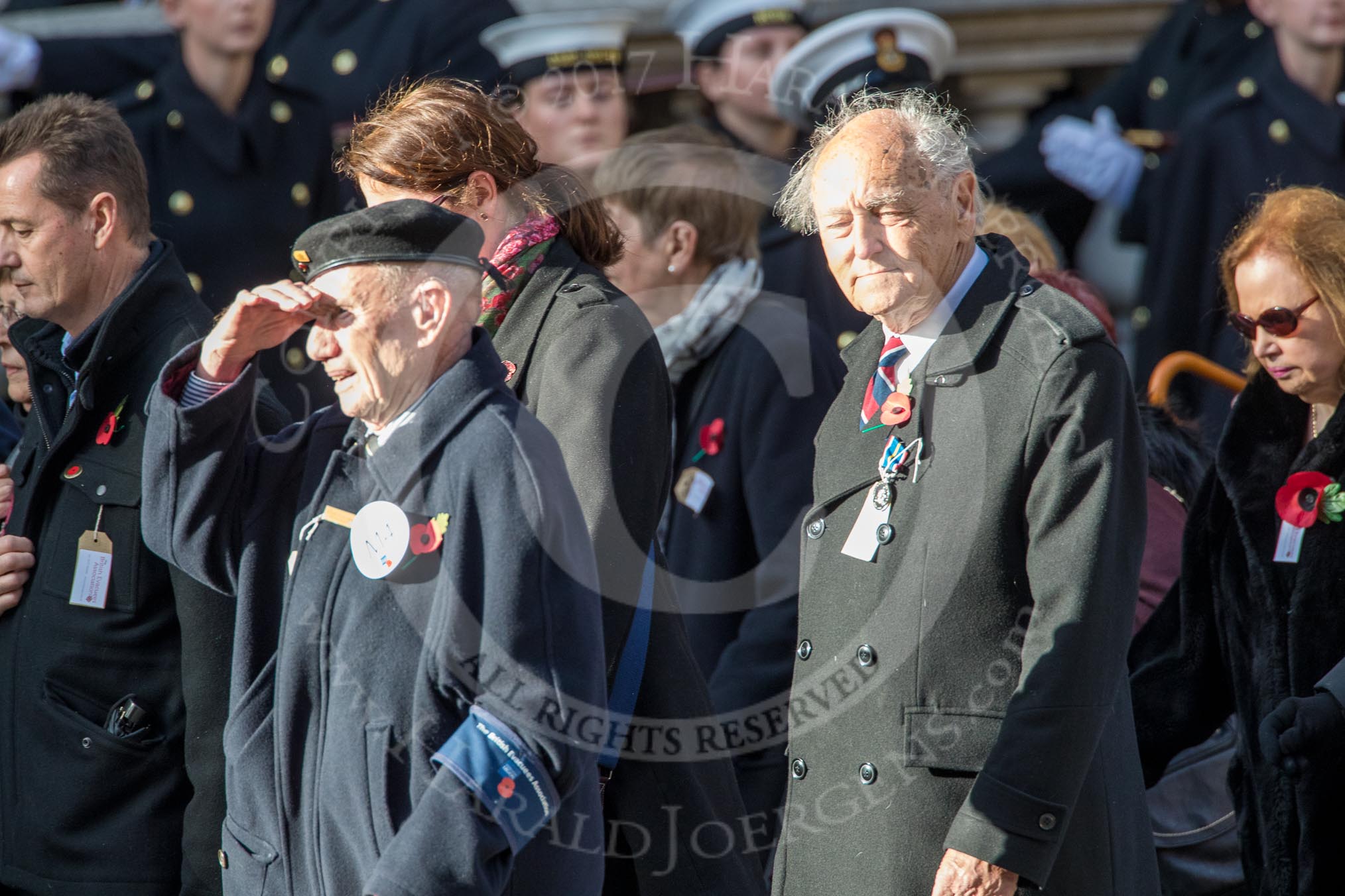 The British Evacuees Association (Group M4, 50 members) during the Royal British Legion March Past on Remembrance Sunday at the Cenotaph, Whitehall, Westminster, London, 11 November 2018, 12:25.