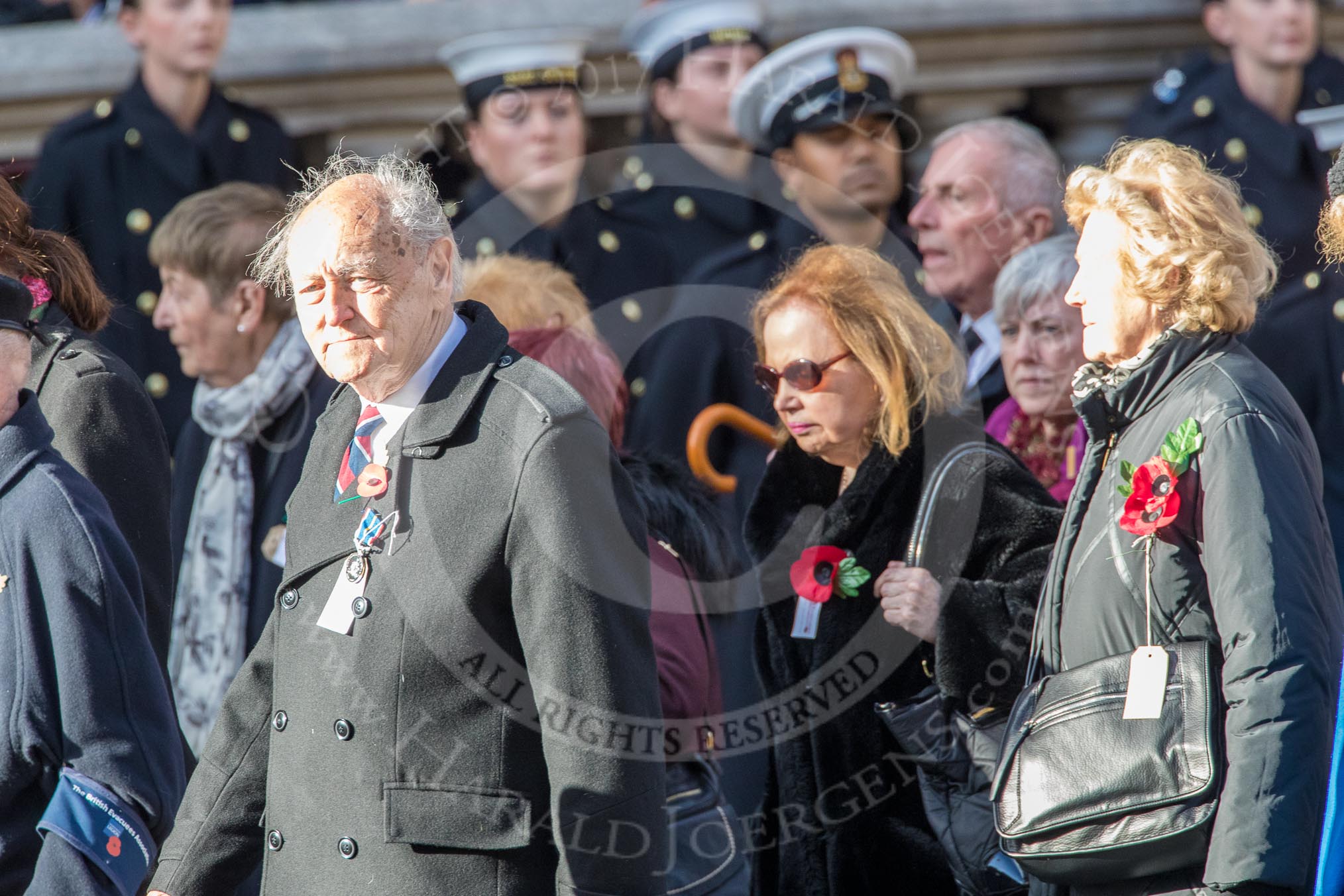 The British Evacuees Association (Group M4, 50 members) during the Royal British Legion March Past on Remembrance Sunday at the Cenotaph, Whitehall, Westminster, London, 11 November 2018, 12:25.
