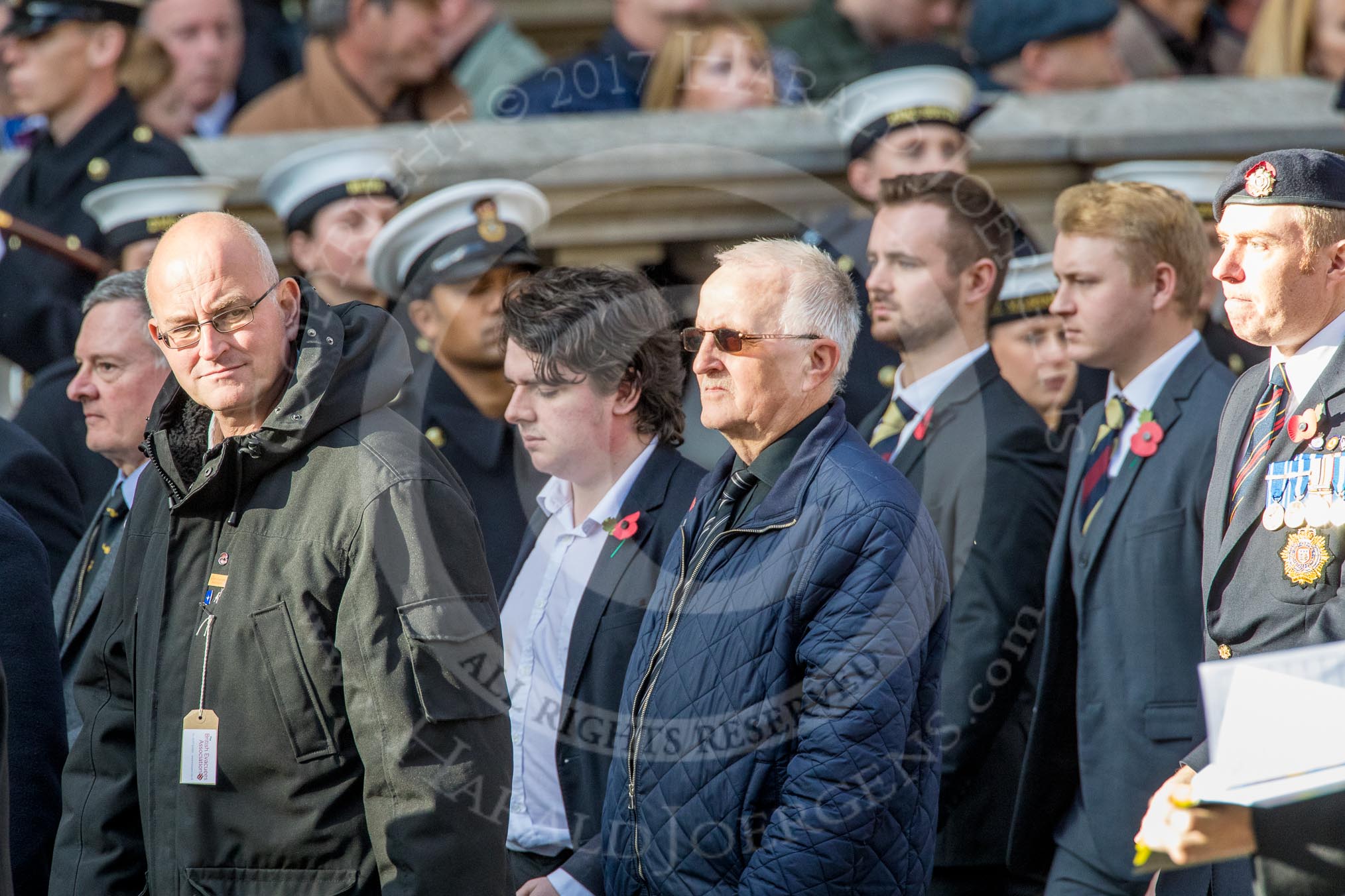 The British Evacuees Association (Group M4, 50 members) during the Royal British Legion March Past on Remembrance Sunday at the Cenotaph, Whitehall, Westminster, London, 11 November 2018, 12:25.