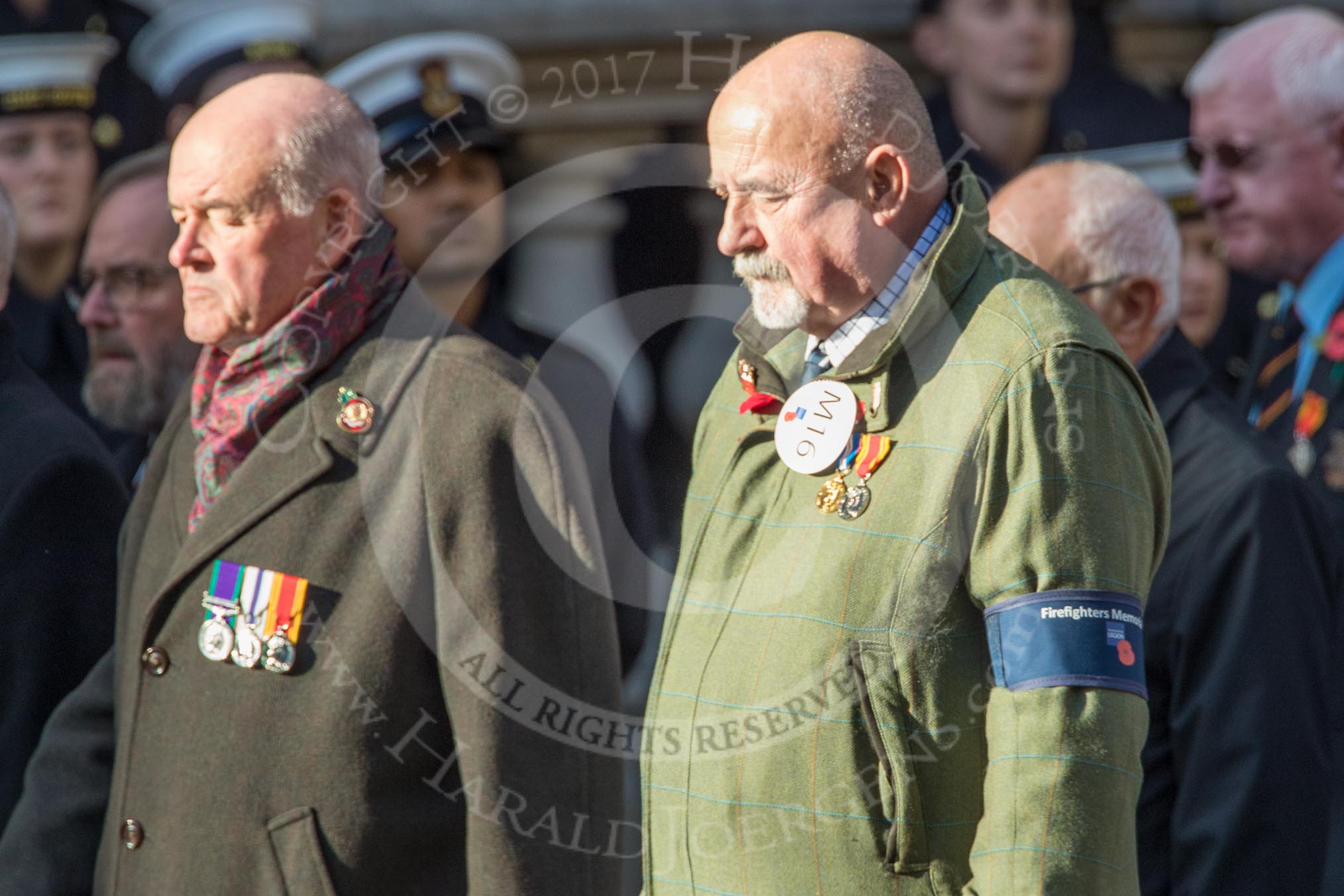 The Firefighters Memorial Trust (Group M16, 25 members) during the Royal British Legion March Past on Remembrance Sunday at the Cenotaph, Whitehall, Westminster, London, 11 November 2018, 12:26.