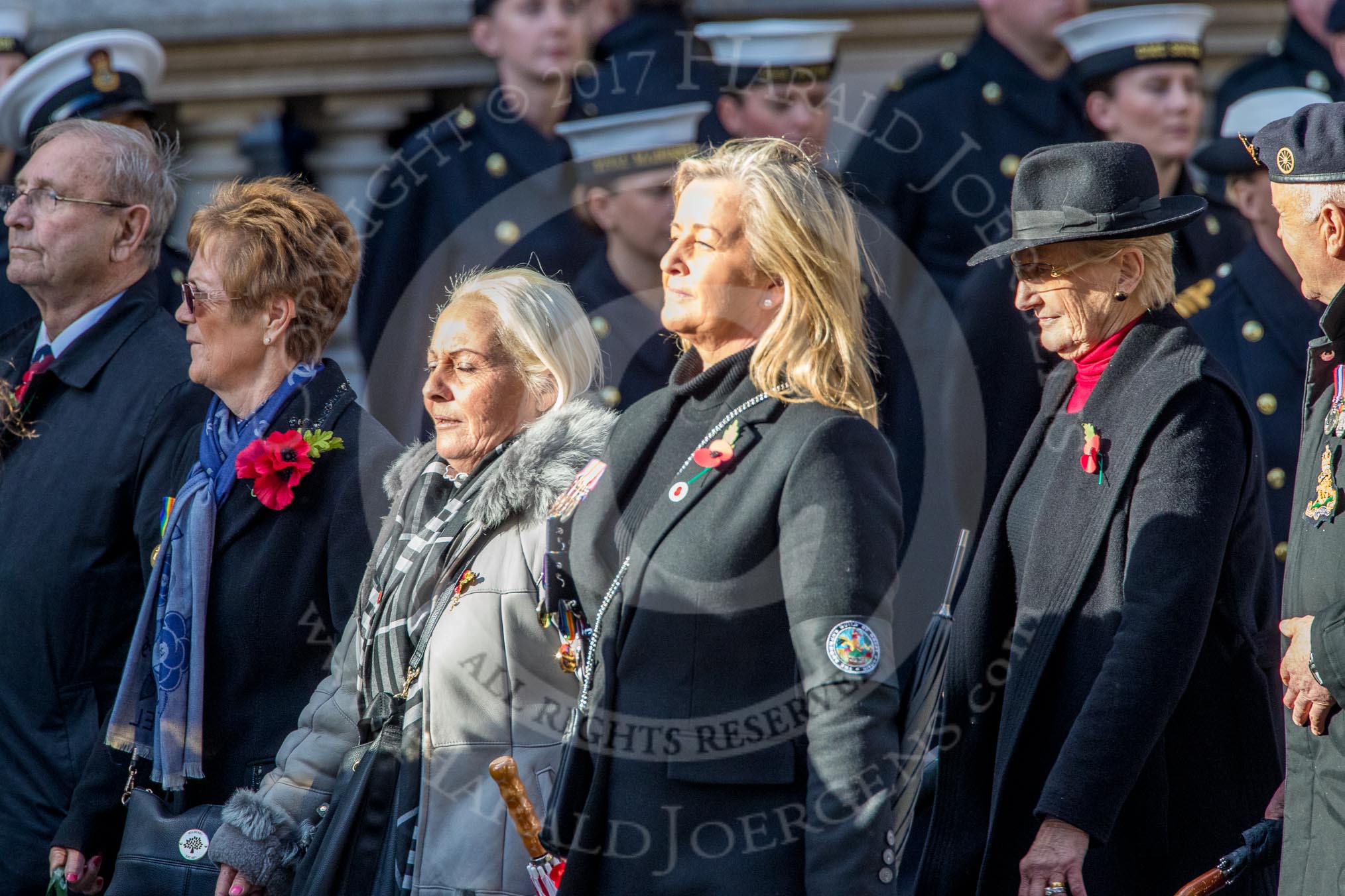 The Showmen's Guild of Great Britain (Group M18, 26 members) during the Royal British Legion March Past on Remembrance Sunday at the Cenotaph, Whitehall, Westminster, London, 11 November 2018, 12:27.