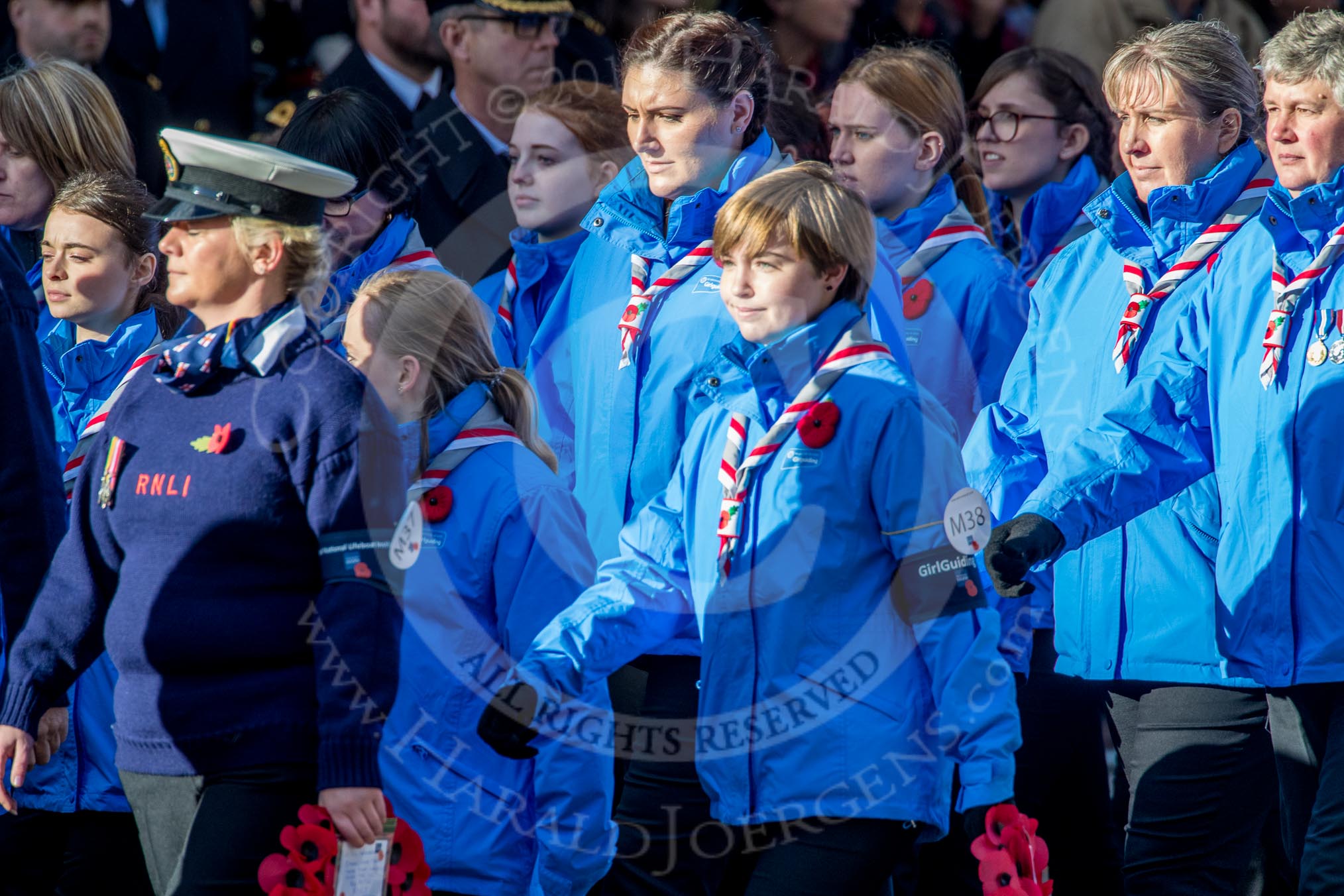 Girlguiding London and South East England(Group M38, 40 members) during the Royal British Legion March Past on Remembrance Sunday at the Cenotaph, Whitehall, Westminster, London, 11 November 2018, 12:30.