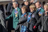 Fleet Air Arm Junglies Association  (Group E12, 22 members) during the Royal British Legion March Past on Remembrance Sunday at the Cenotaph, Whitehall, Westminster, London, 11 November 2018, 11:43.