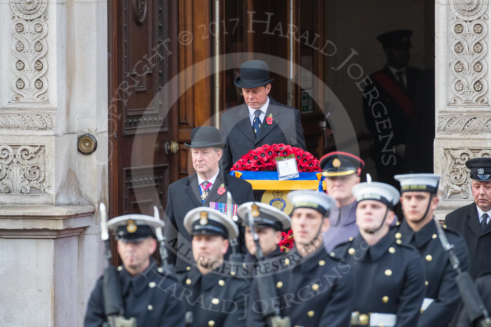 Representatives of The Royal British Legion, London Transport, the Royal Air Forces Association , the Royal Naval Association , the Royal Commonwealth Ex­Services League, the Royal British Legion Scotland, and the Royal British Legion Women’s Section leaving the Foreign and Commonwealth Office before the Remembrance Sunday Cenotaph Ceremony 2018 at Horse Guards Parade, Westminster, London, 11 November 2018, 10:35.