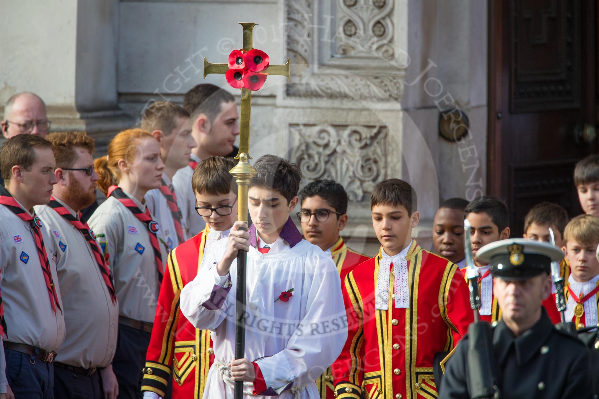 The Bishop’s Procession, here the the Choir, led by the Cross­Bearer, Michael Clayton Jolly, leaving the Foreign and Commonwealth Office during the Remembrance Sunday Cenotaph Ceremony 2018 at Horse Guards Parade, Westminster, London, 11 November 2018, 10:53.