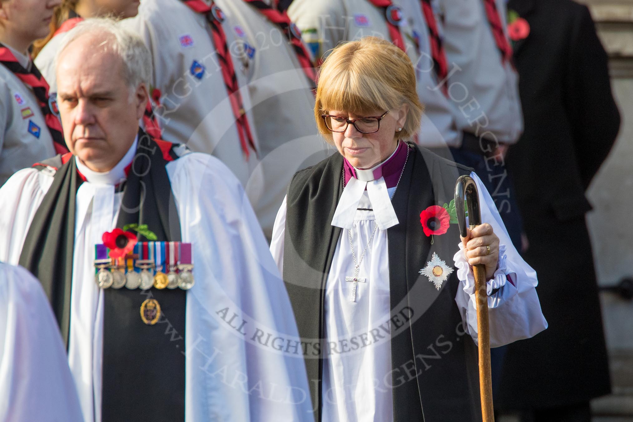 The Bishop’s Procession leaving the Foreign and Commonwealth Office, here the Sub­Dean of Her Majesty's Chapels Royal, Lieutenant Colonel the Reverend Canon Paul Wright, and The Right Reverend and Right Honourable Dame Sarah Mullally DBE, the Lord Bishop of London during the Remembrance Sunday Cenotaph Ceremony 2018 at Horse Guards Parade, Westminster, London, 11 November 2018, 10:53.