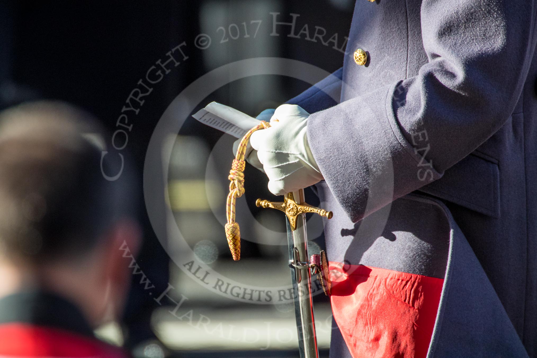 HRH The Prince of Wales (Prince Charles) holding the hymn sheet during the Remembrance Sunday Cenotaph Ceremony 2018 at Horse Guards Parade, Westminster, London, 11 November 2018, 11:18.