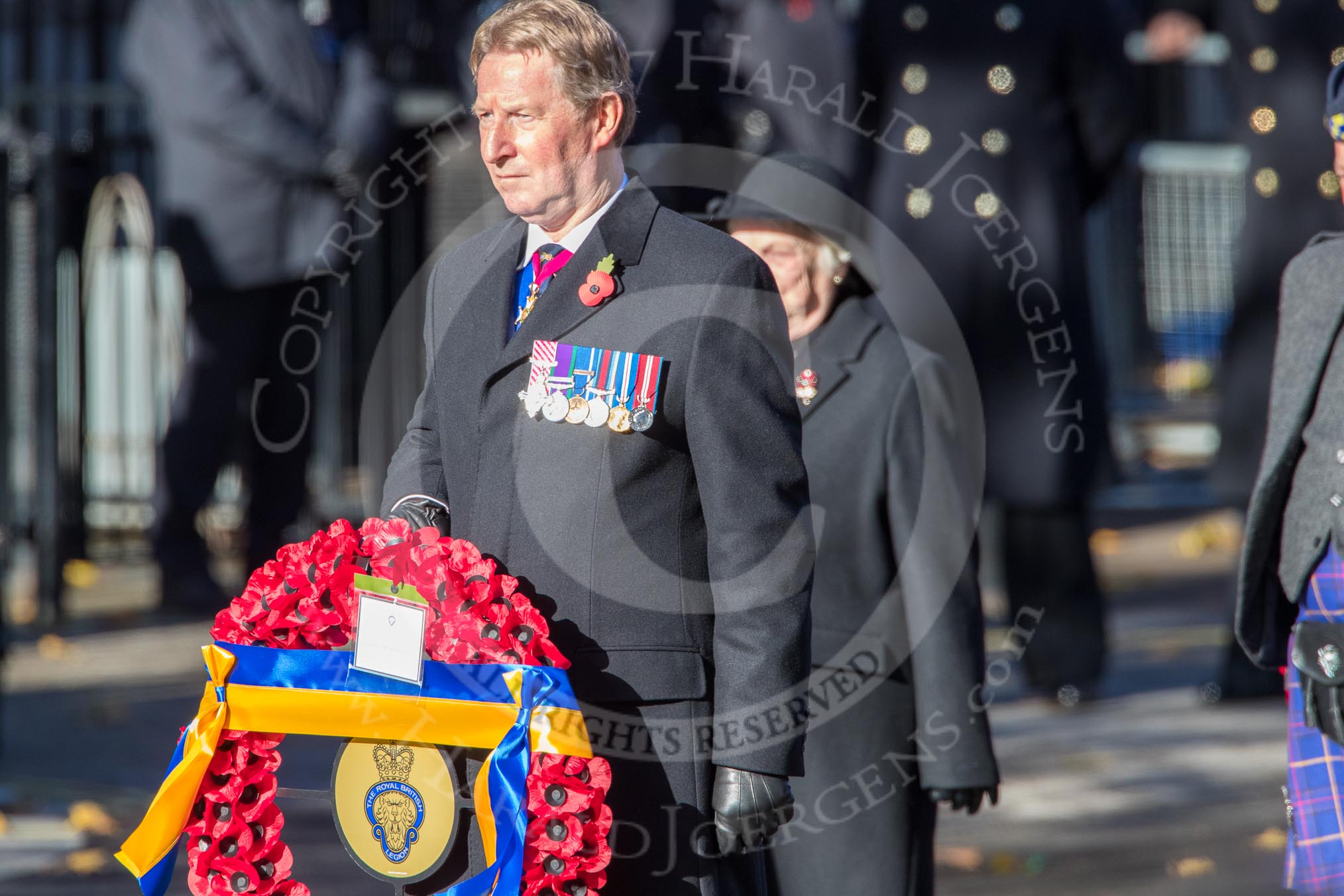 Air Marshal David Walker CB CBE AFC MA RAF (Retired), National President of the Royal British Legion, with the legion's wreath during the Remembrance Sunday Cenotaph Ceremony 2018 at Horse Guards Parade, Westminster, London, 11 November 2018, 11:27.