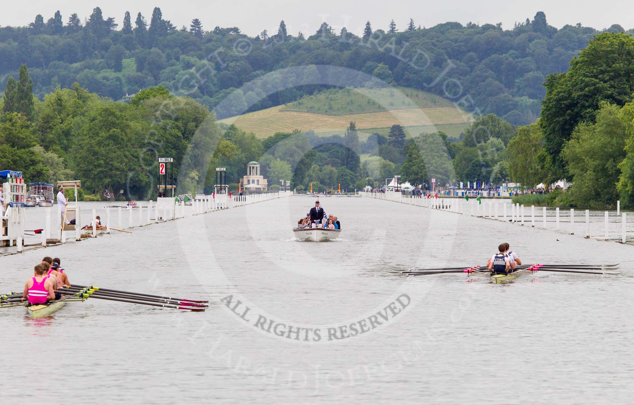 Henley Royal Regatta 2013 (Wednesday): The Henley Royal Regatta race course seen after the race between Griffen Boat Club, on the left ("Bucks station"), and Upper Thames Rowing Club 'B' on the right ("Berks station"), behind the competing boats the umpire's launch, and in the background Temple Island. Griffen won by 3 1/2 length..
River Thames between Henley and Temple Island,
Henley-on-Thames,
Berkshire,
United Kingdom,
on 03 July 2013 at 09:37, image #16