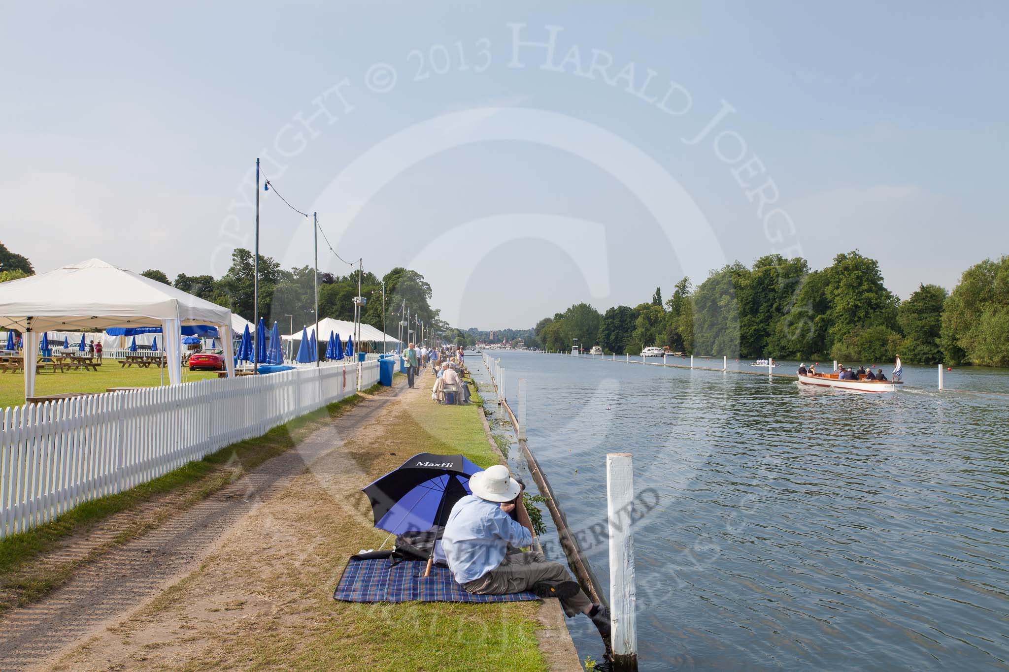 Henley Royal Regatta 2013, Saturday: Fifteen minutes to go to the start of the Saturday races - looking down the race course towards the finish line. Image #61, 06 July 2013 09:45 River Thames, Henley on Thames, UK